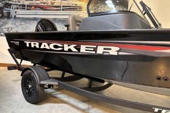 2026 Tracker Pro Guide V-16 WT boat on trailer, black exterior with bold branding.
