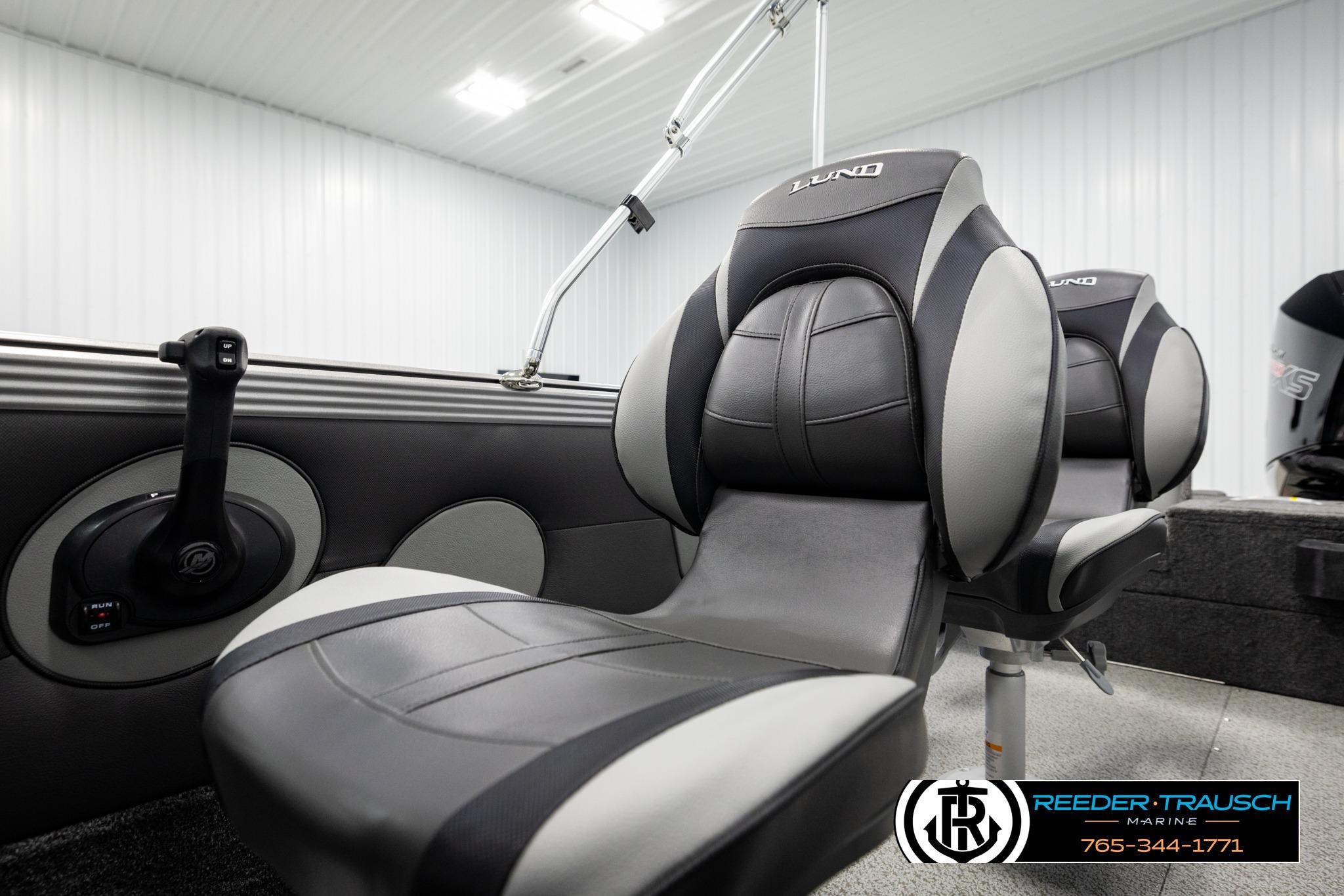 2026 Lund 1975 Tyee boat interior with sleek, modern seating and control panel.