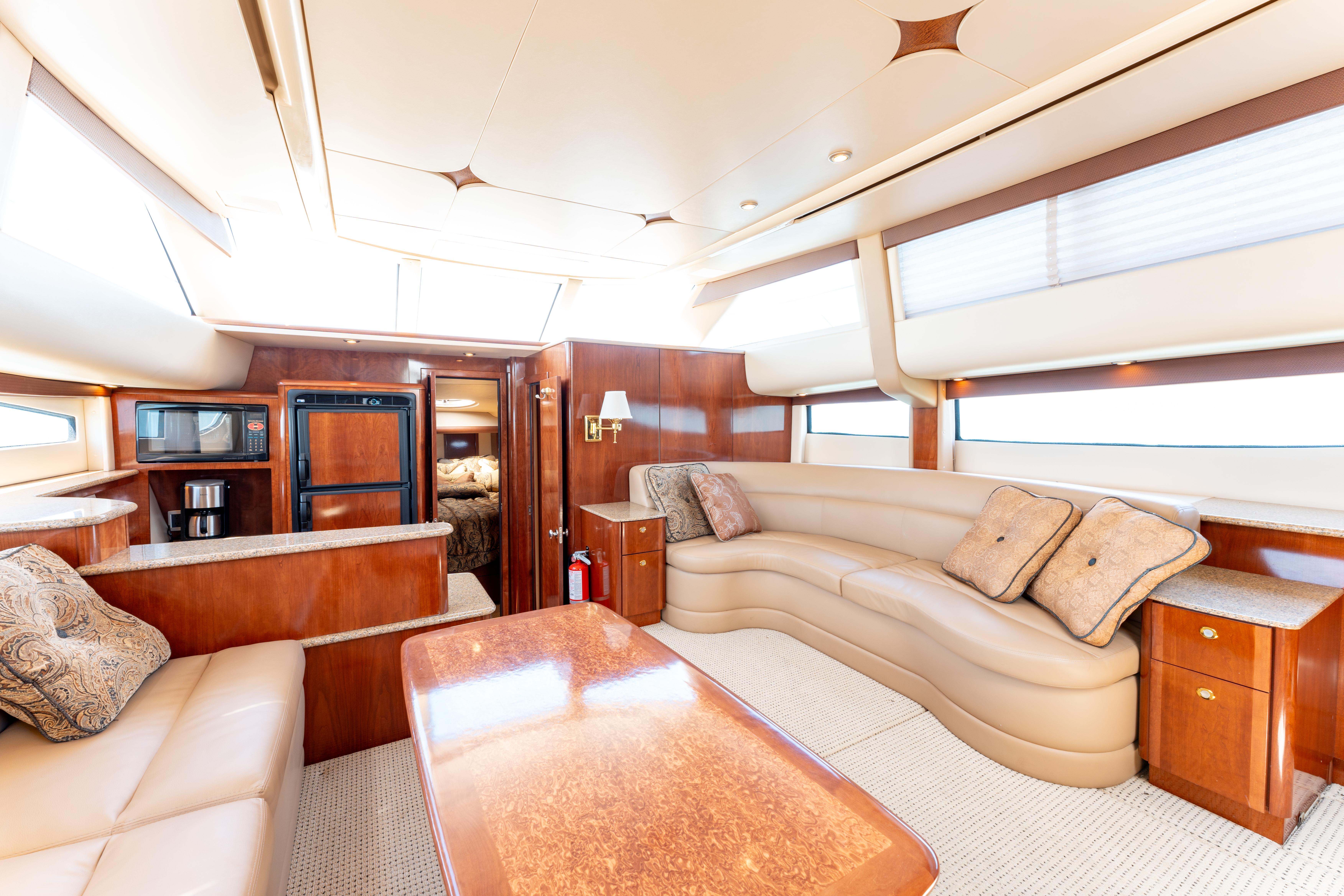 Luxurious interior of 2008 Meridian 459 Motoryacht with plush seating and elegant wood finishes.