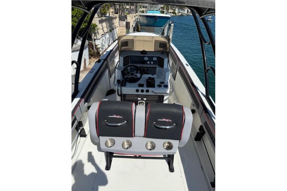 1996 Powerplay Powerboats 33 Sportfish cockpit with dual seats and control panel.