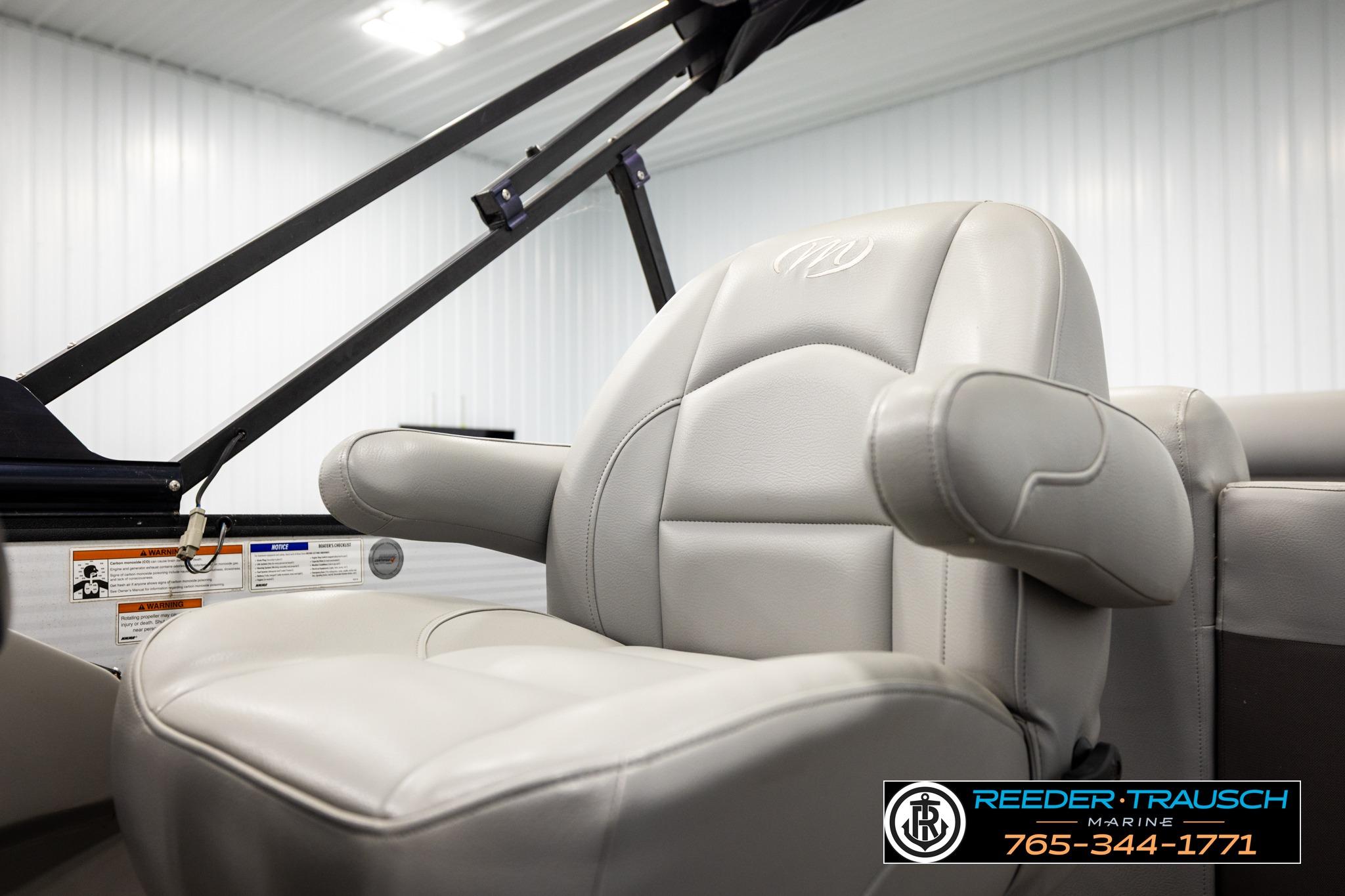 Luxurious seating on 2019 Manitou Oasis SR VP pontoon boat, featuring plush armrests.