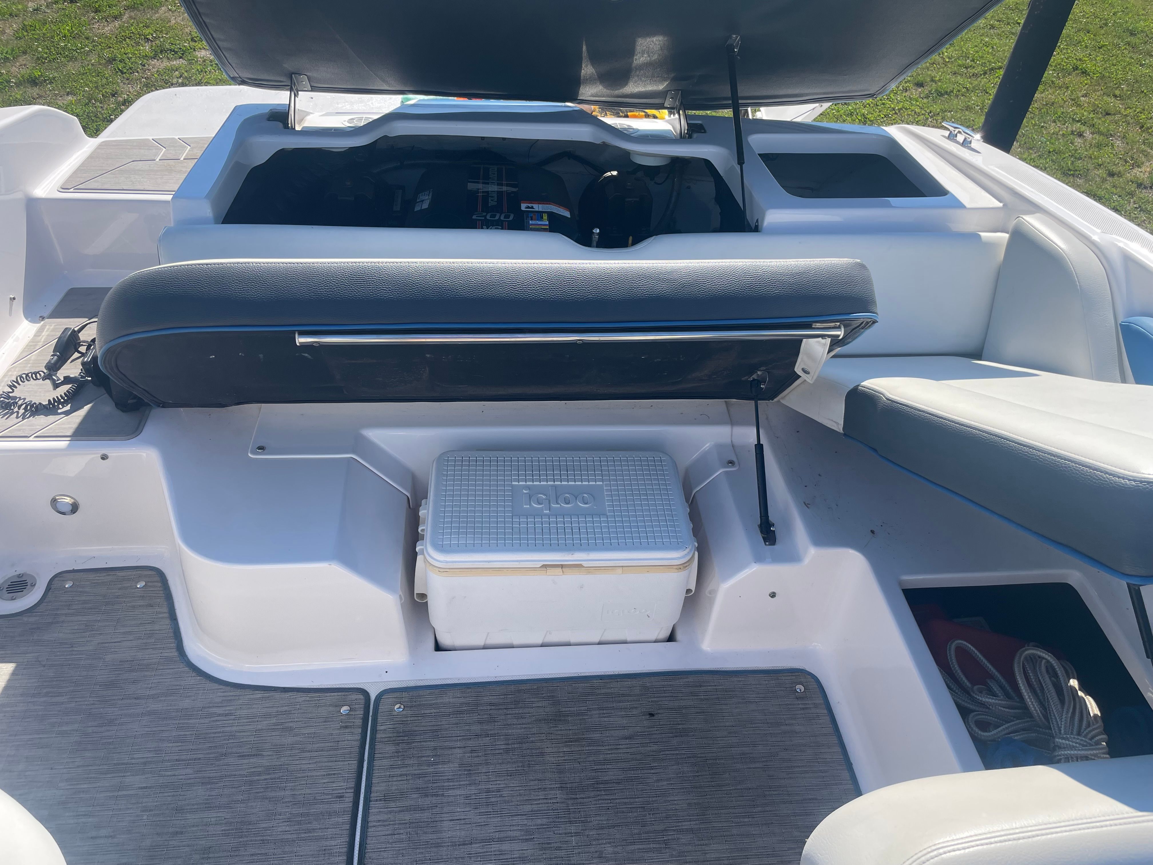 The image shows the cockpit of a 2016 Regal 1900 ESX Bowrider with a cooler.