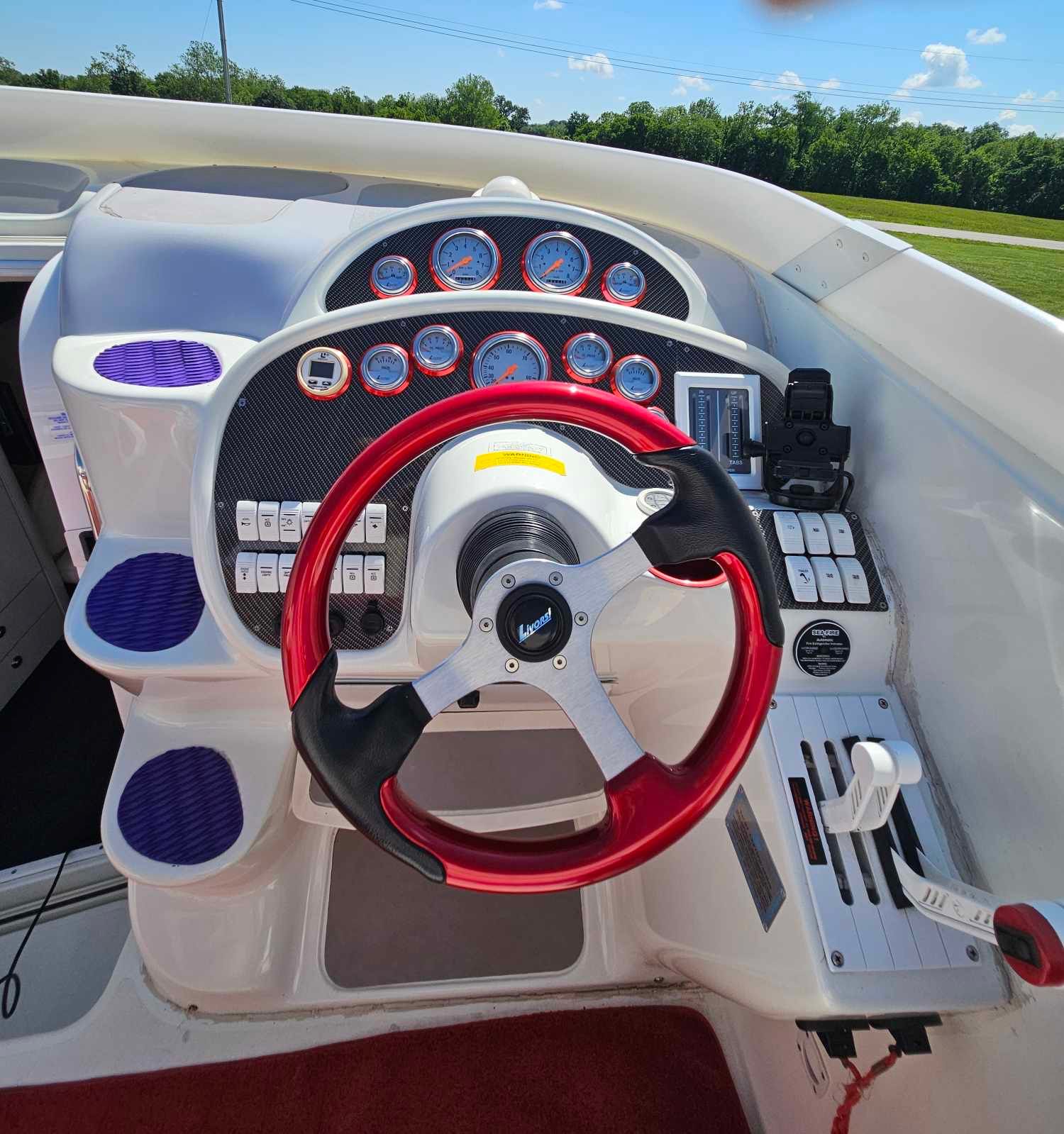 1997 Baja 38 Special Boss cockpit with red steering wheel.