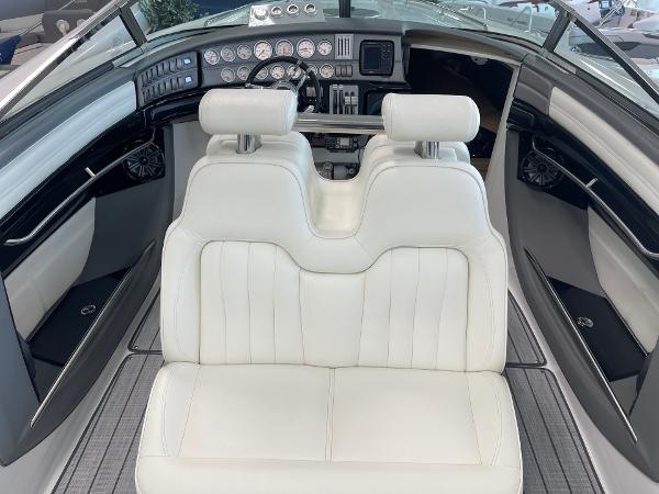 Luxury interior of 2005 Cobalt 343 boat with white leather seats and modern dashboard.