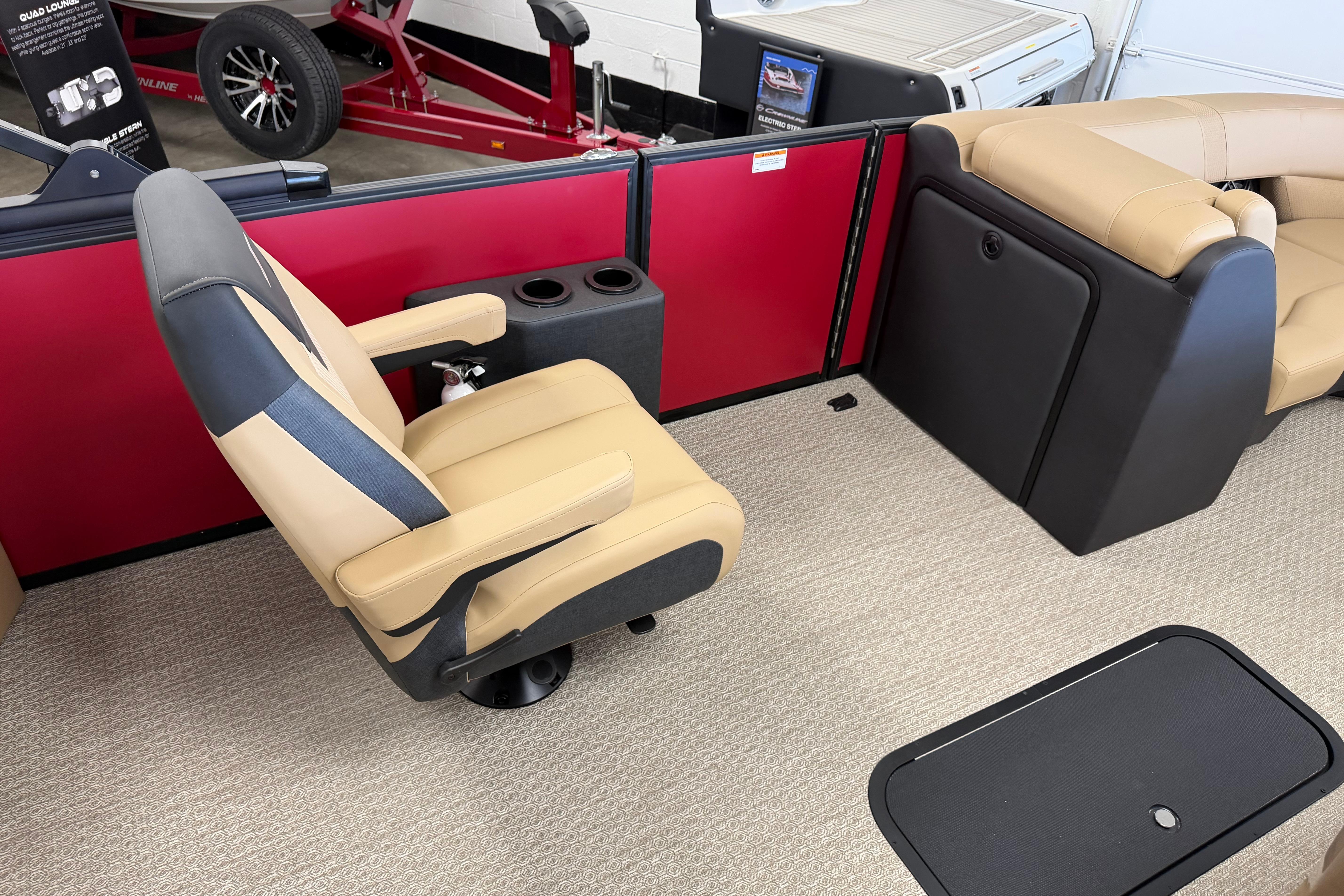 Luxury seating in 2026 Evotti 523CS boat with beige upholstery and cup holders.