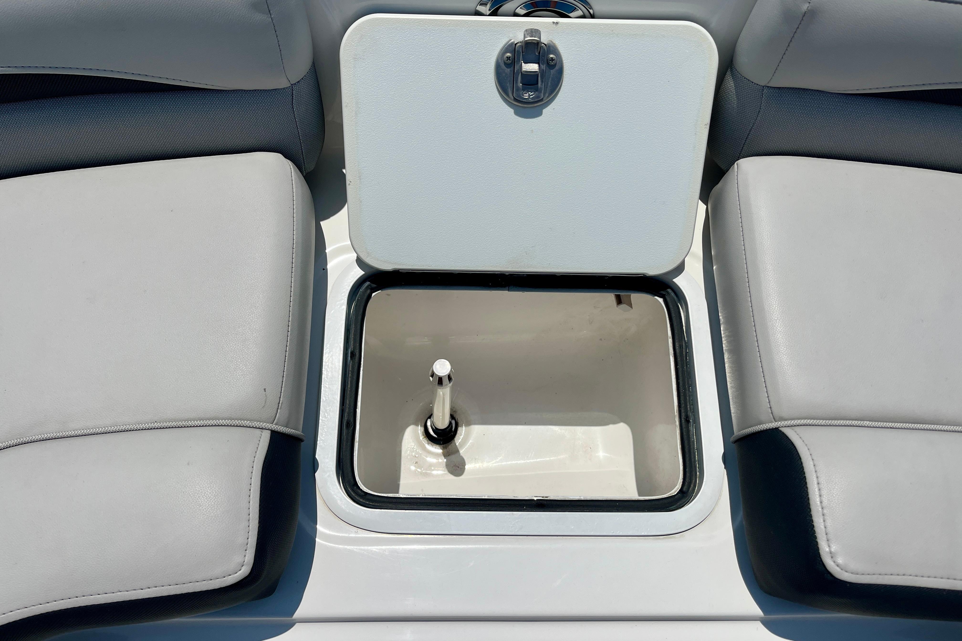 2024 Hurricane Sundeck Sport 218 OB boat storage compartment with open hatch.