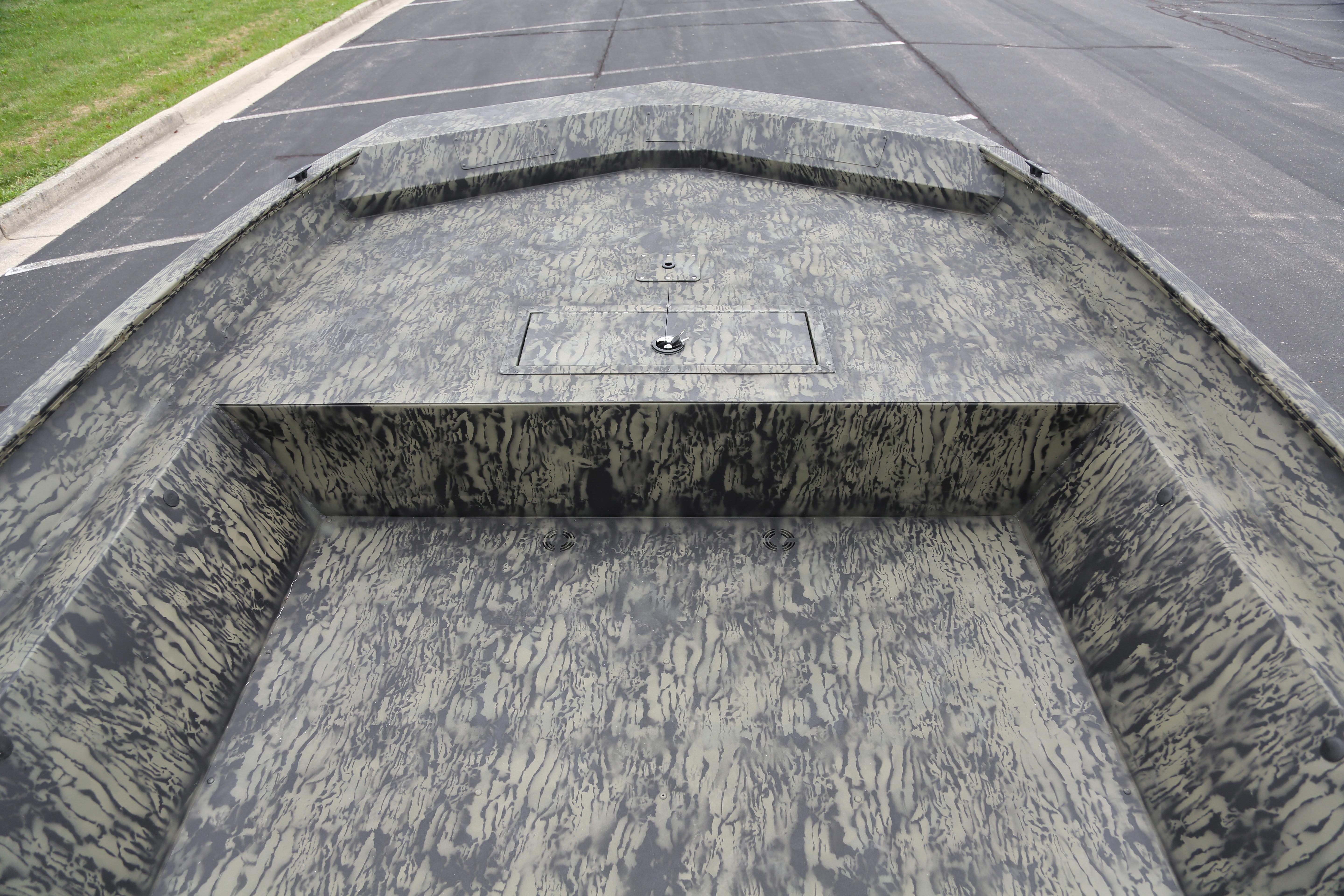 2026 Tracker GRIZZLY 2072 Utility boat with camouflage interior design.