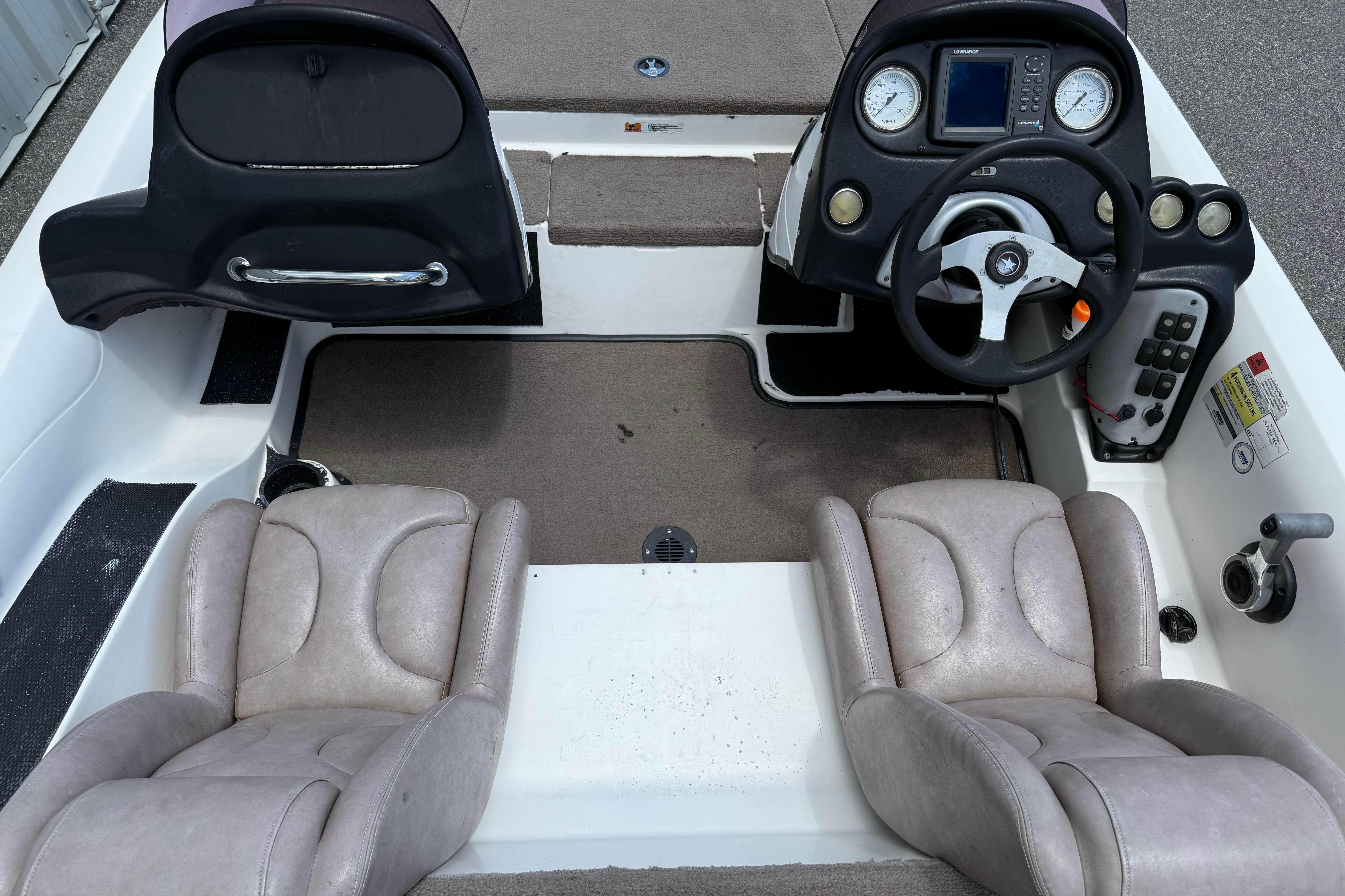 2006 Stratos 294 Pro XL boat interior with dual seats and steering console.