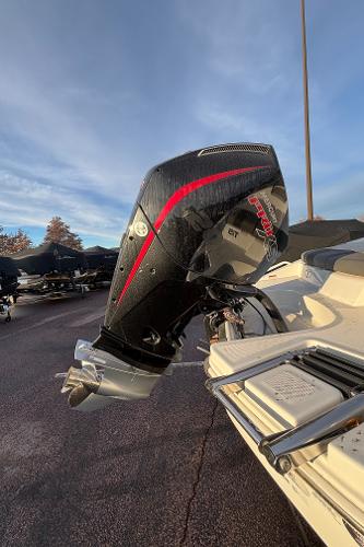 2024 Tahoe T21 boat with sleek black and red outboard motor.