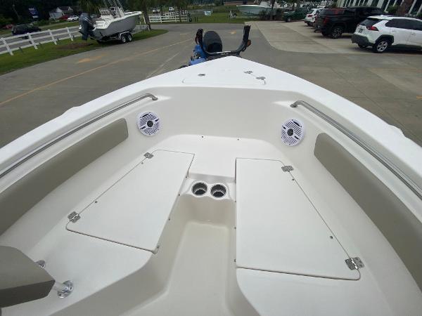 2024 Key West 203 FS boat interior with storage compartments and speakers.