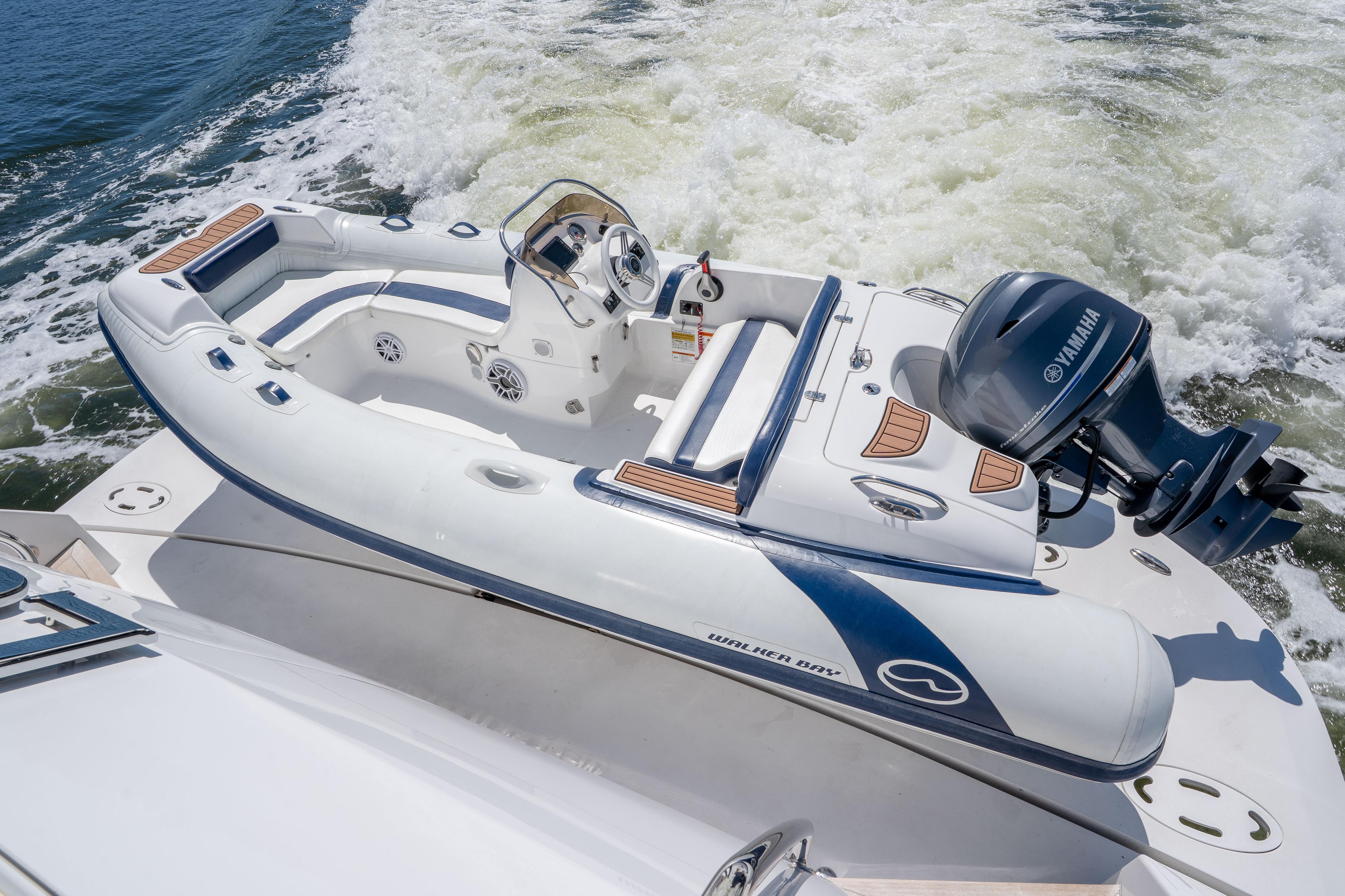 2021 Hatteras M75 Panacera yacht with Yamaha engine cruising on open water.