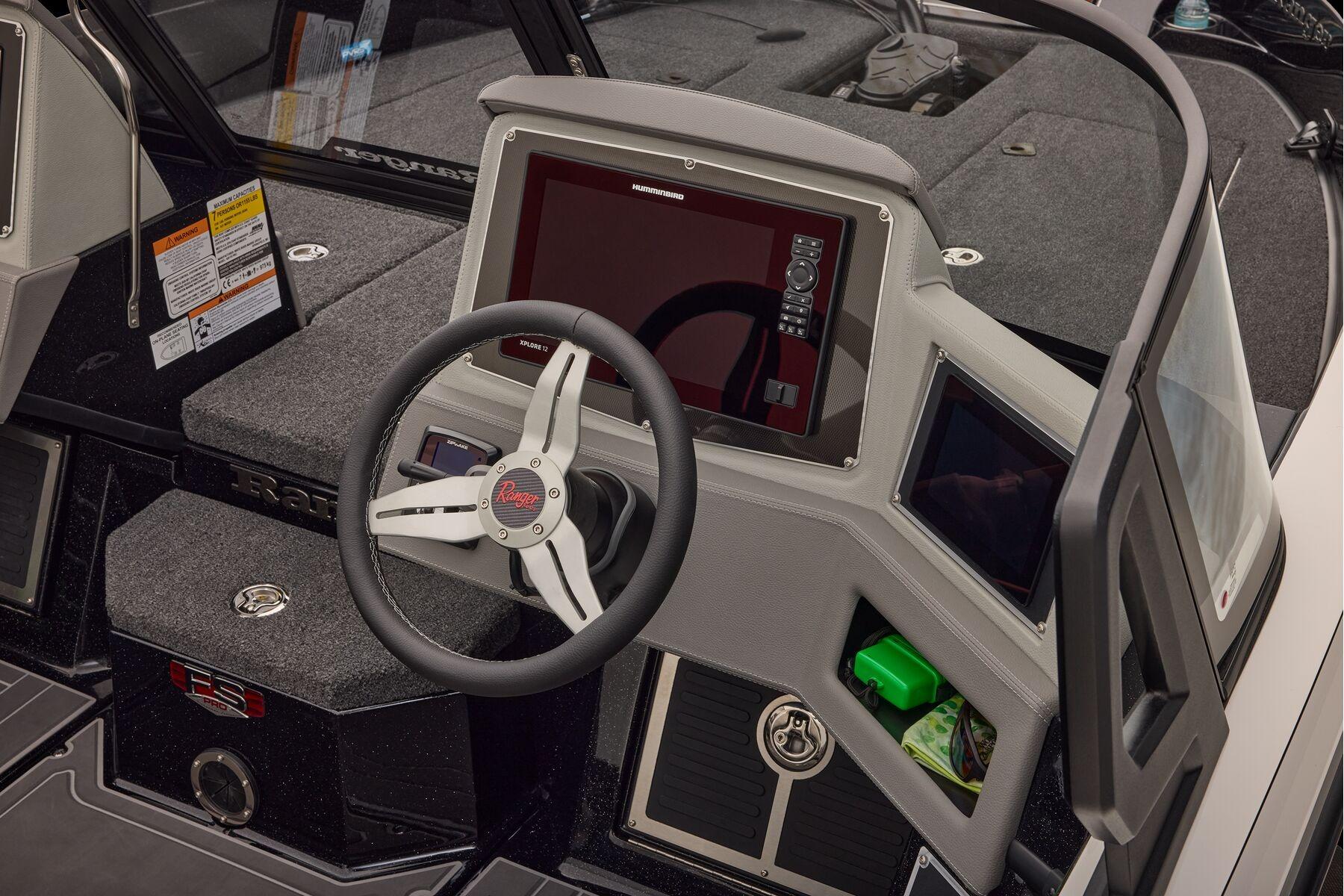Manufacturer Provided Image: 2026 Ranger 620xFS Pro boat dashboard with steering wheel and electronic display.