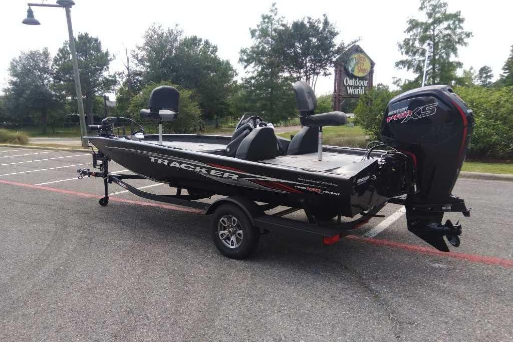 2026 Tracker Pro Team 190 boat in parking lot, featuring sleek design and powerful engine.