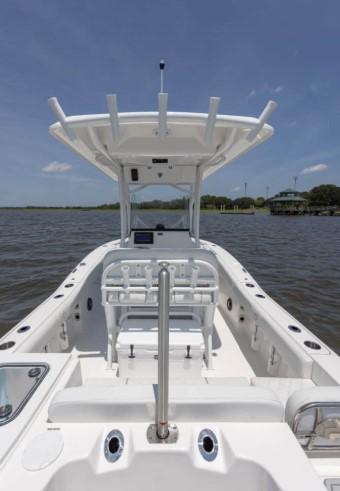 2026 Sea Fox 228 Commander boat on calm water, featuring a spacious deck and modern design.