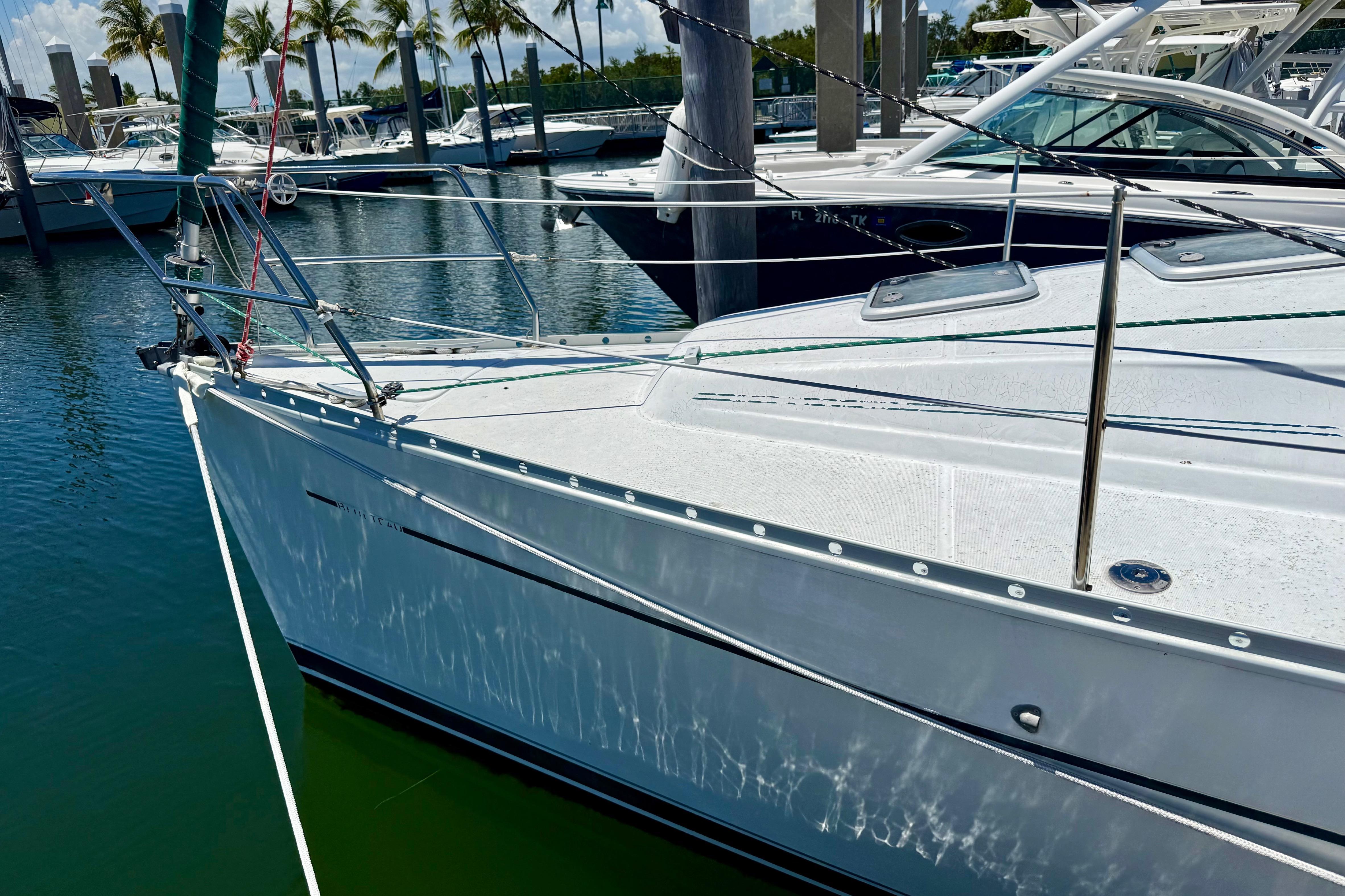 2002 Beneteau Oceanis Clipper 311 sailboat docked in a marina.