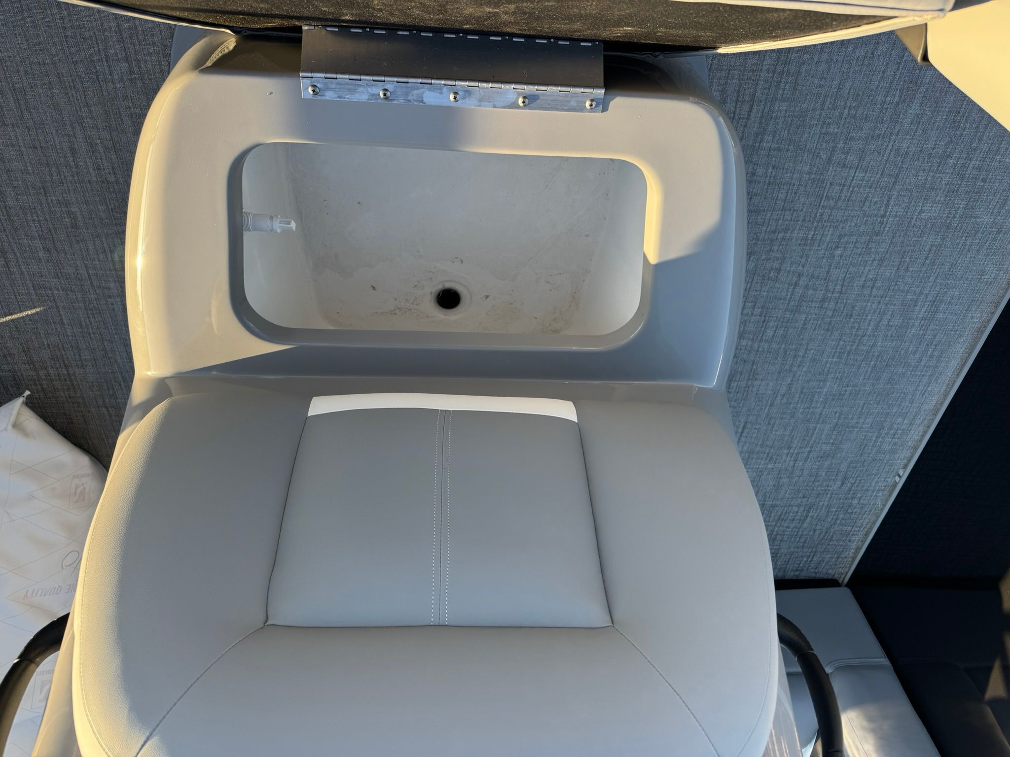 Seat and storage on a 2026 Landau Alure 21CC Fish.