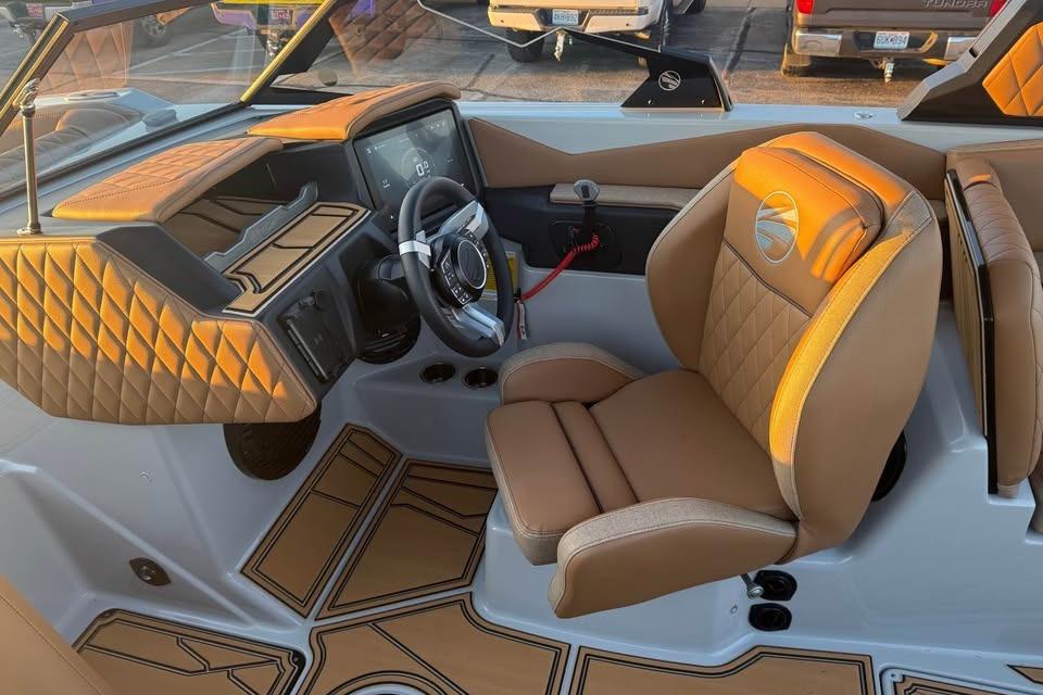 2026 Tigé Z3 boat interior with tan leather seats and modern dashboard design.