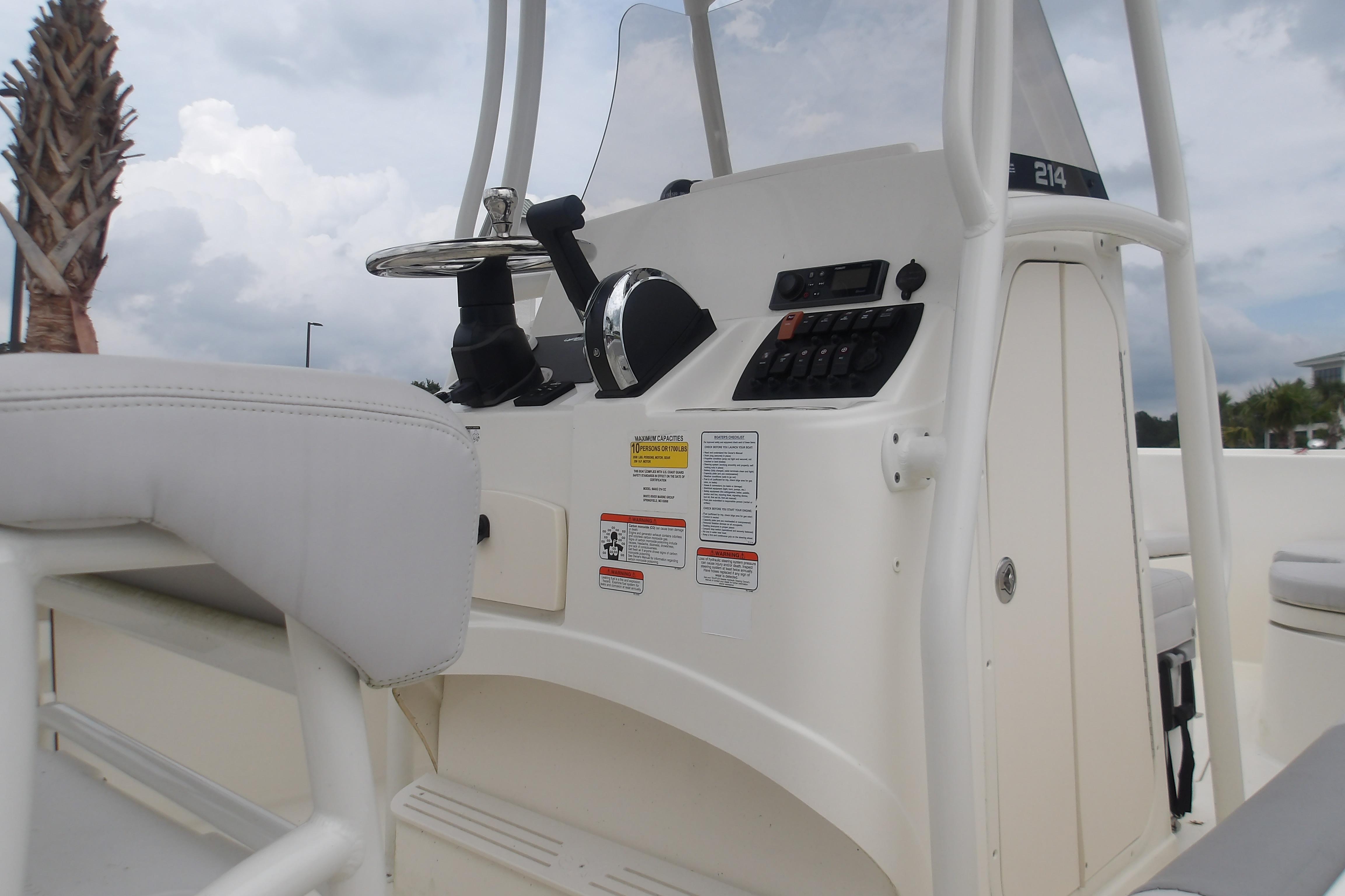 2025 Mako 214 Center Console boat interior with steering wheel and control panel.