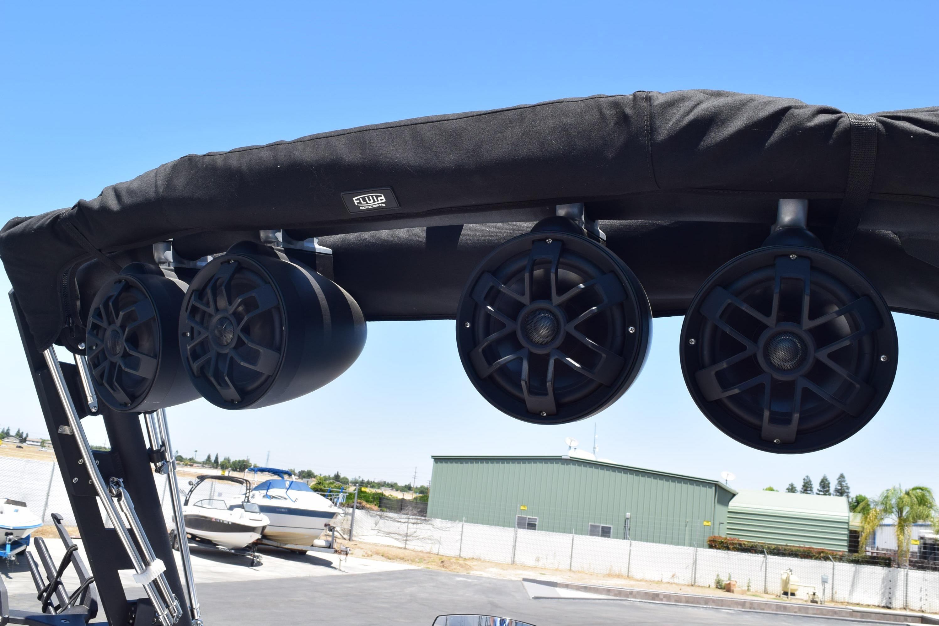 2019 Axis A22 boat with mounted speakers on a black canopy.