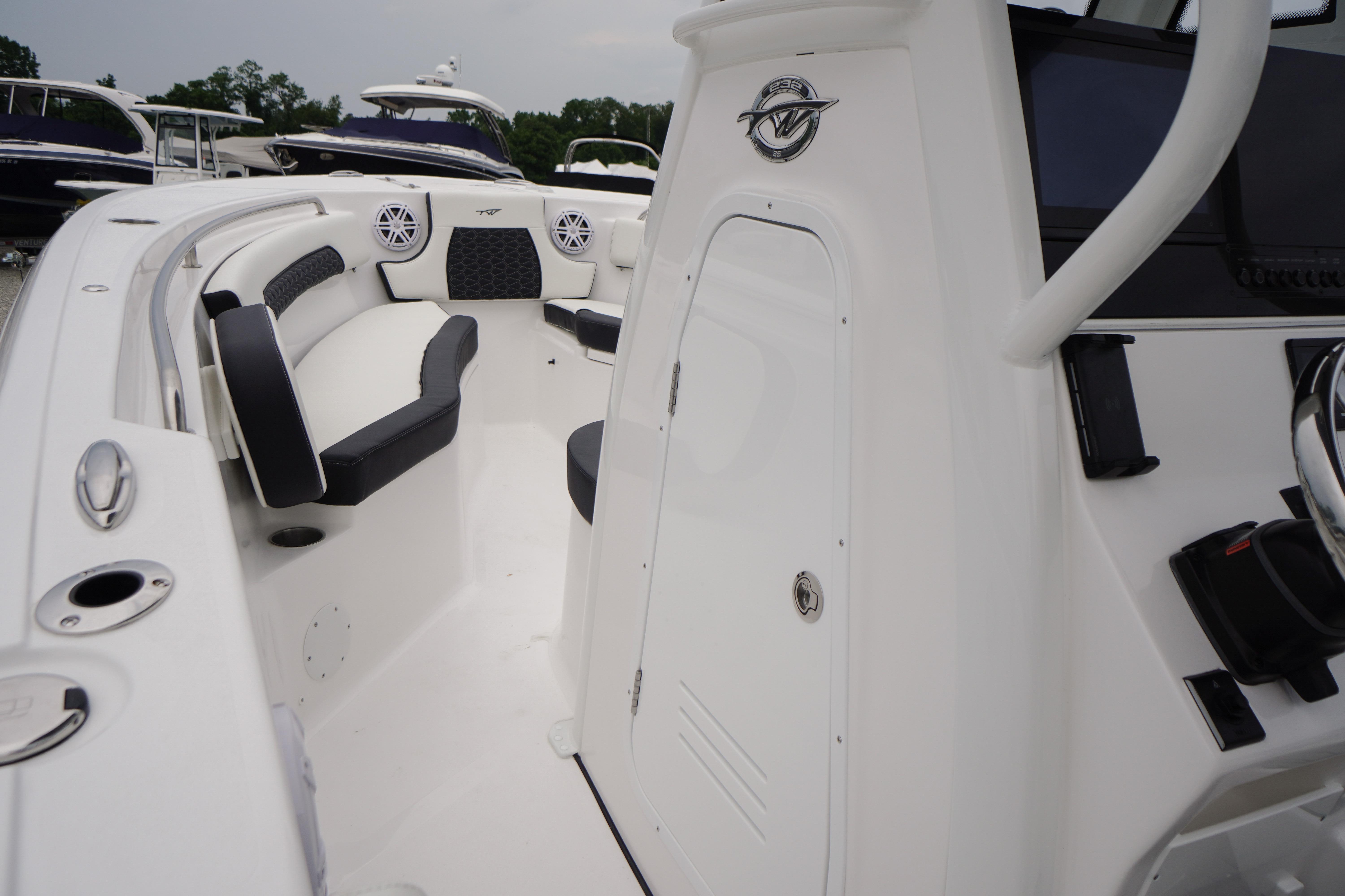 2026 Tidewater 232 SS boat interior with seating and control panel.