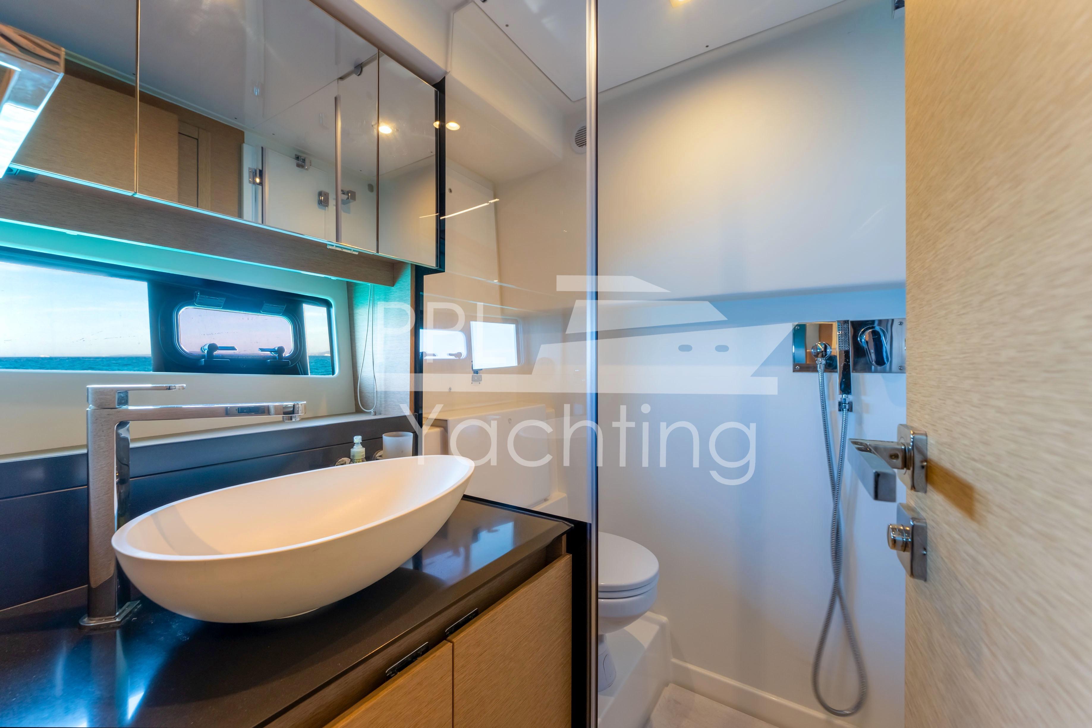 Luxurious bathroom interior of 2019 Prestige 460 yacht with modern fixtures and elegant design.