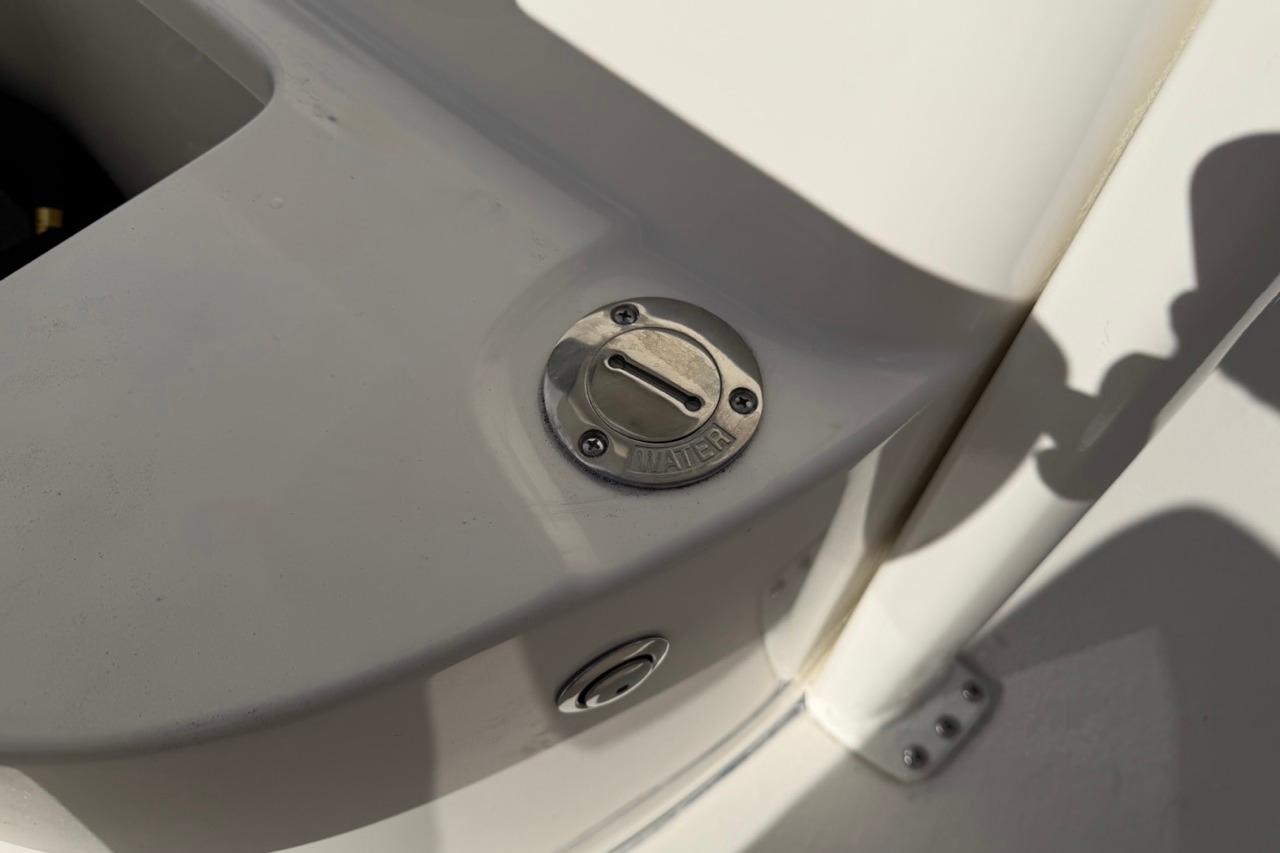 Fuel cap on 2026 Key West 239 FSR boat deck in sunlight.
