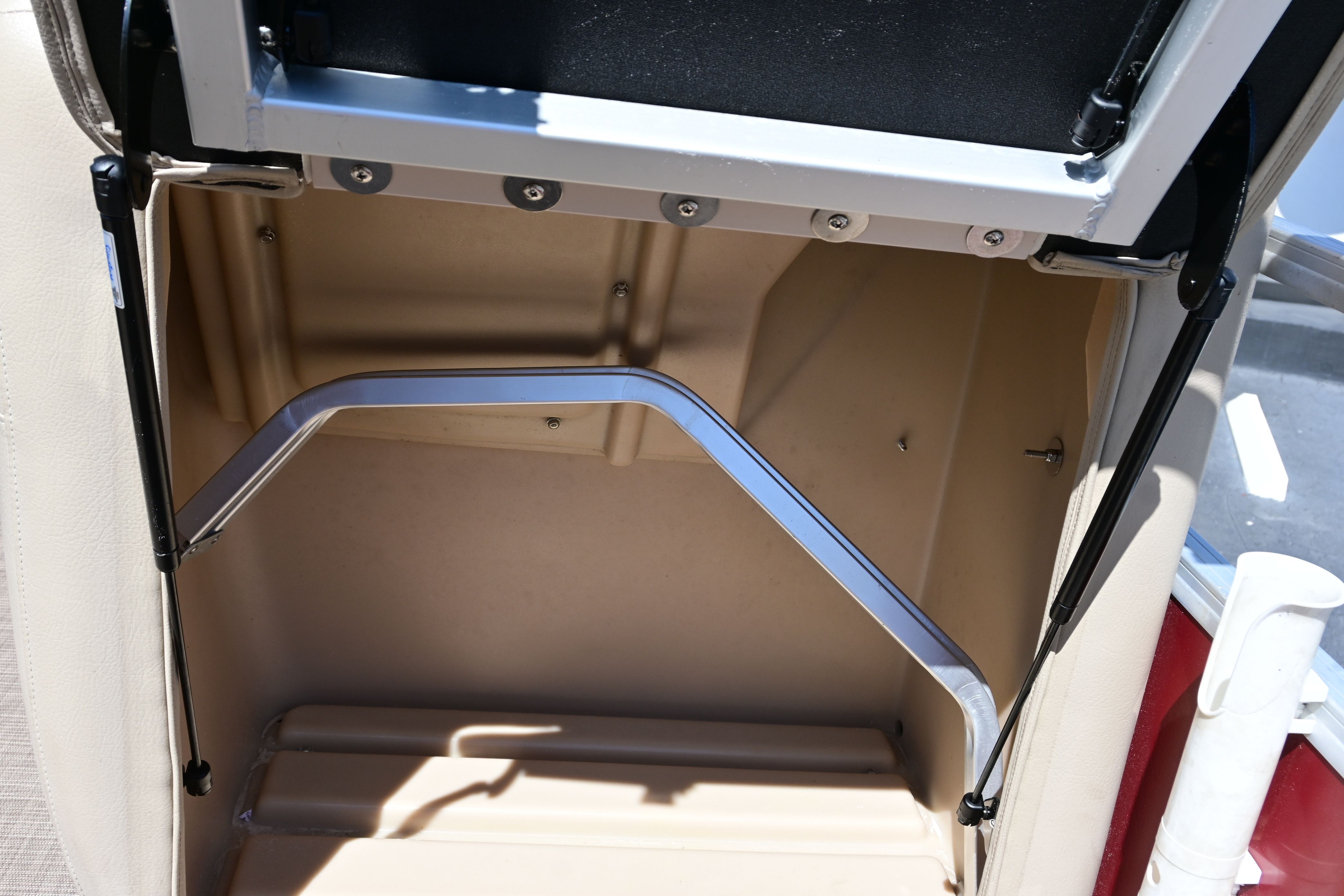 Interior of a 2019 Sun Tracker FISHI boat, open storage compartment.