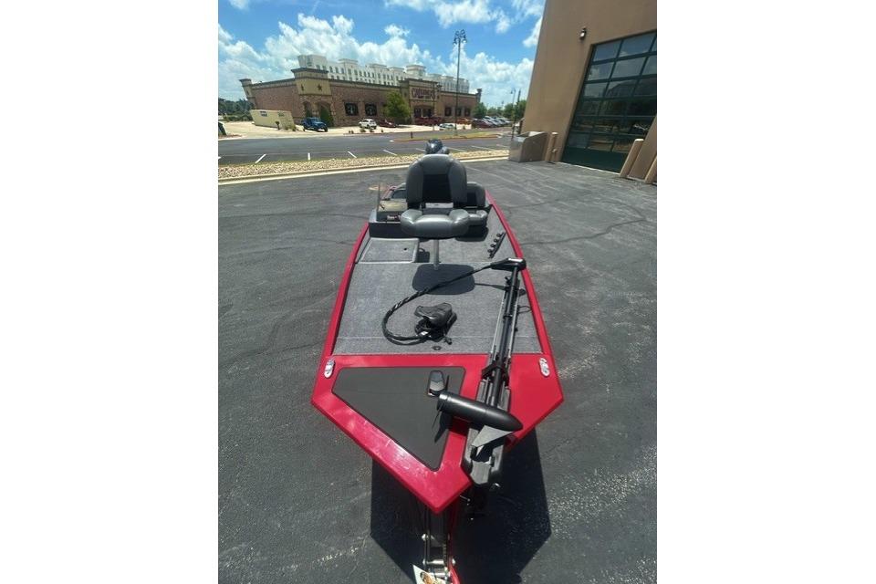 2026 Tracker Bass Tracker Classic XL boat with red trim, parked outdoors.