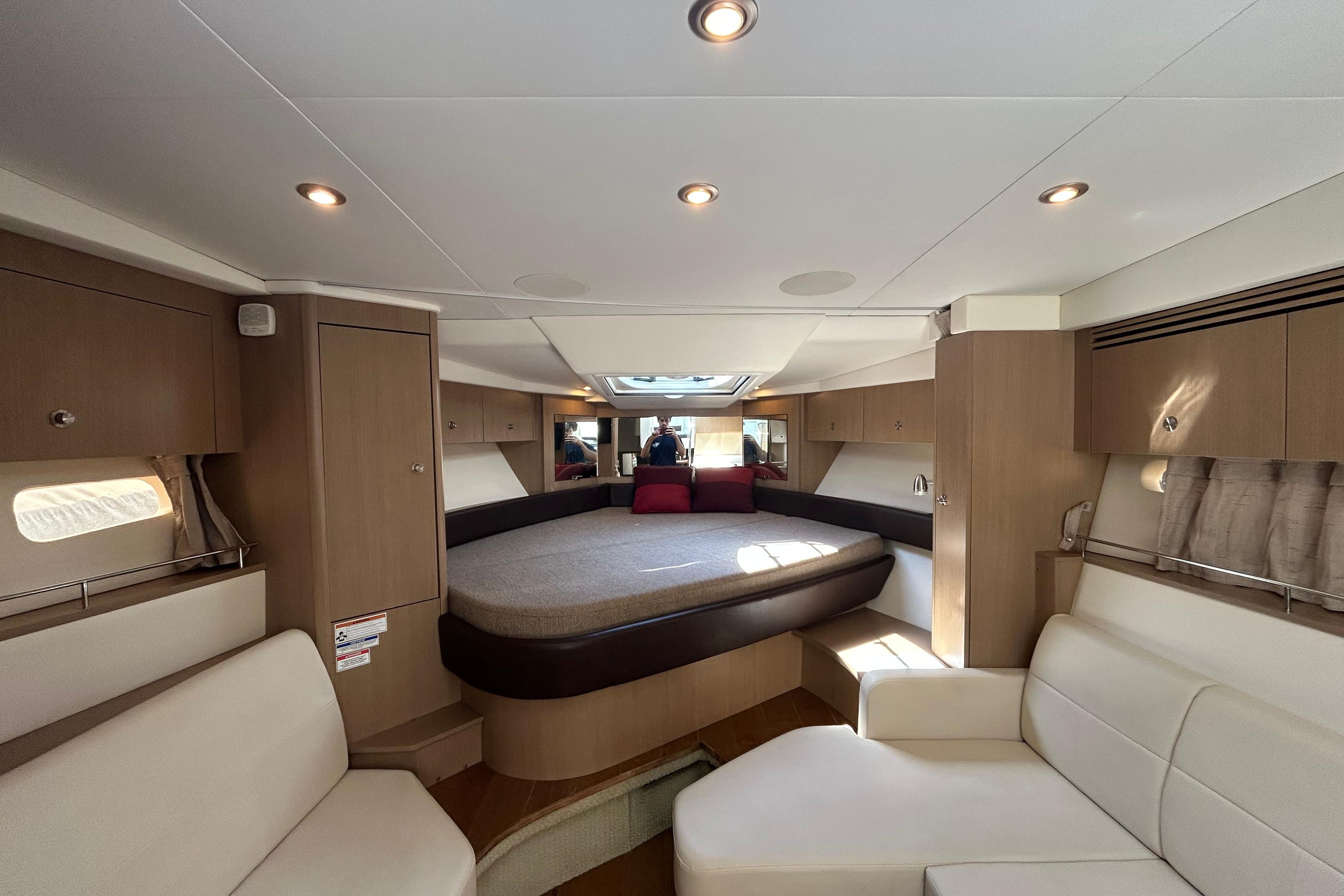 Luxurious interior of 2019 Sea Ray Sundancer 350 yacht with elegant seating and lighting.