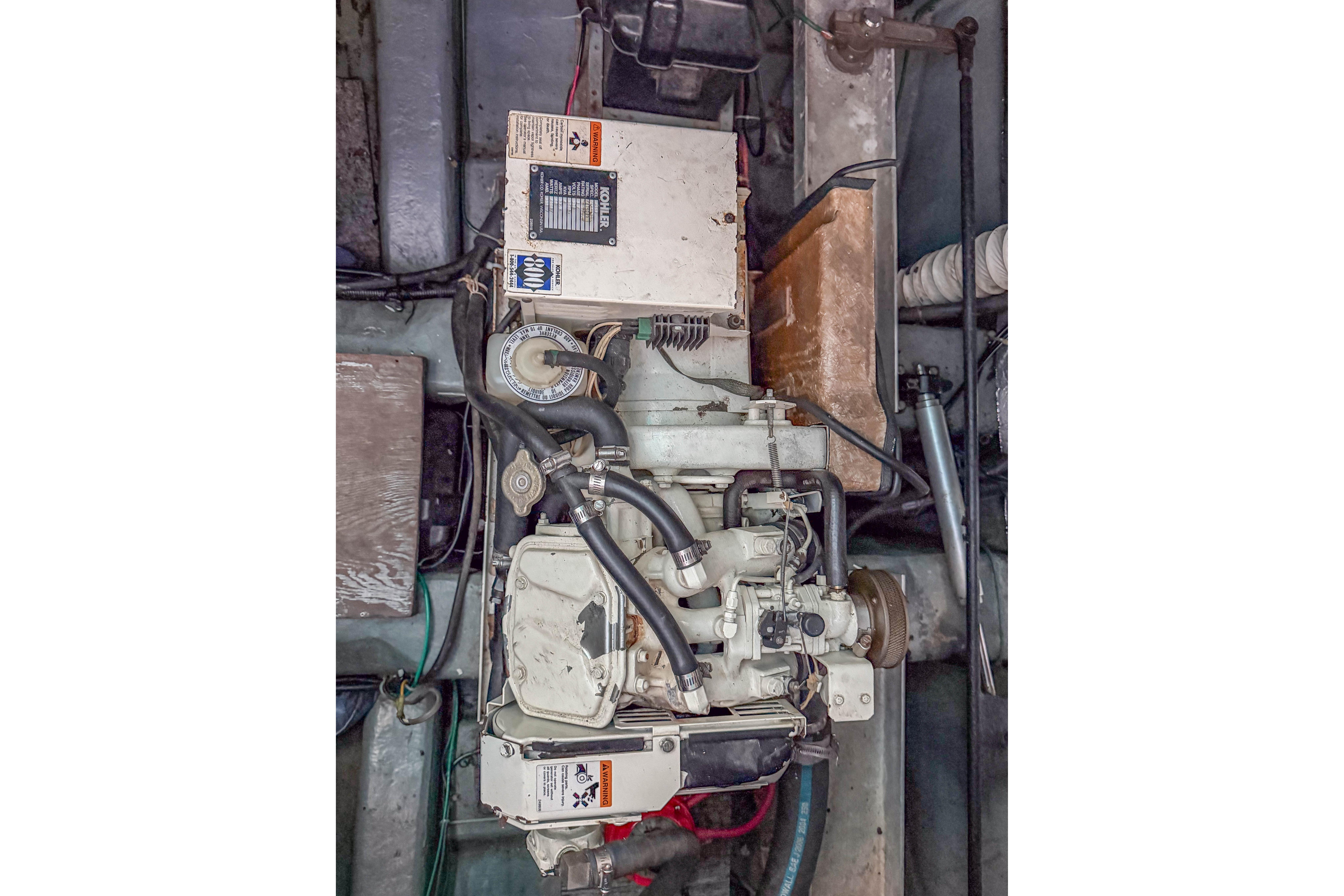 Engine compartment of a 1994 Carver 380 Santego boat, showcasing mechanical components.