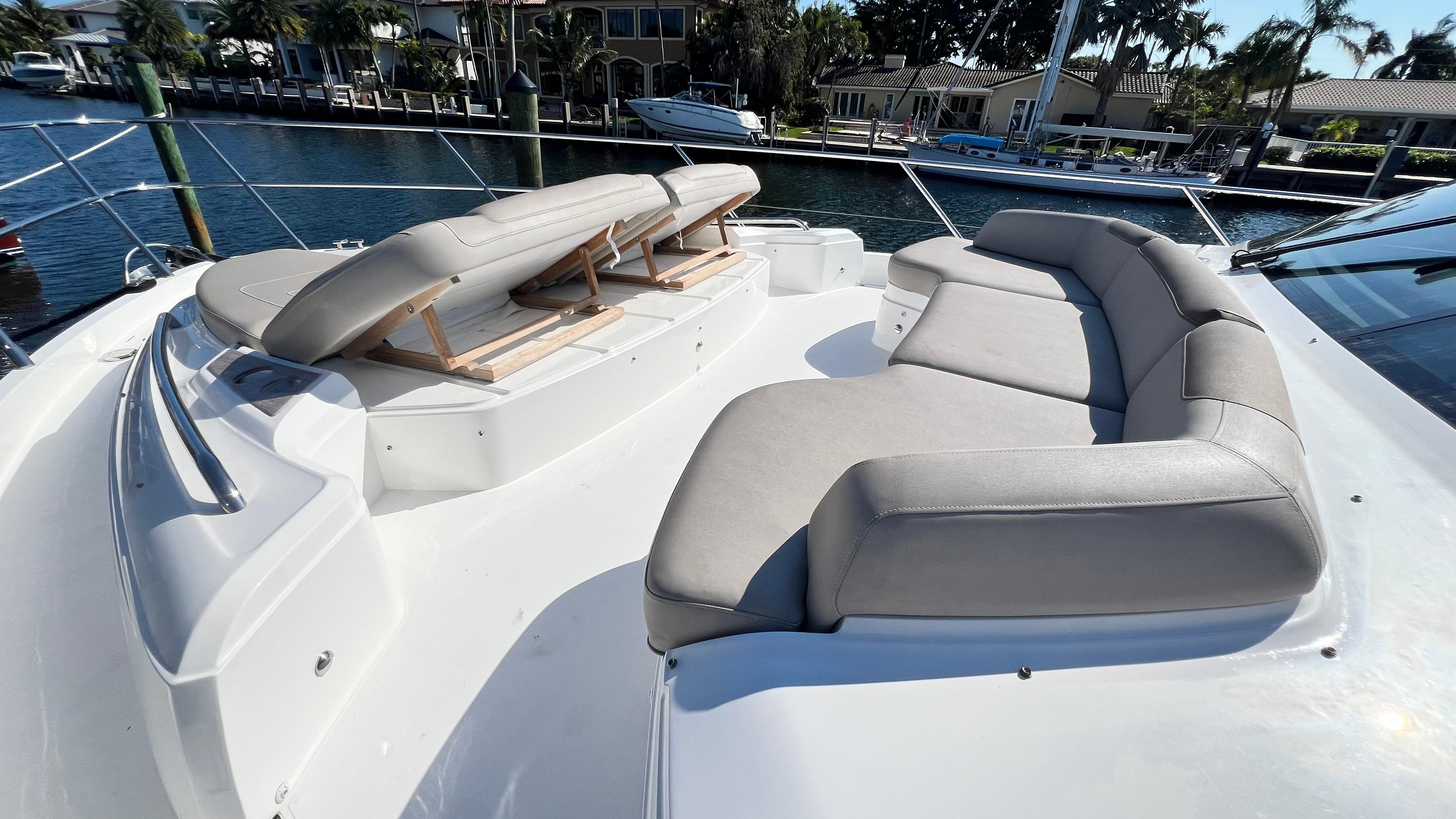 Luxurious 2019 Princess F62 yacht with spacious sunbathing area and comfortable seating.