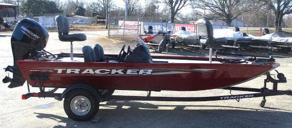 2025 Tracker Pro 170 boat in red, parked on a trailer outdoors.