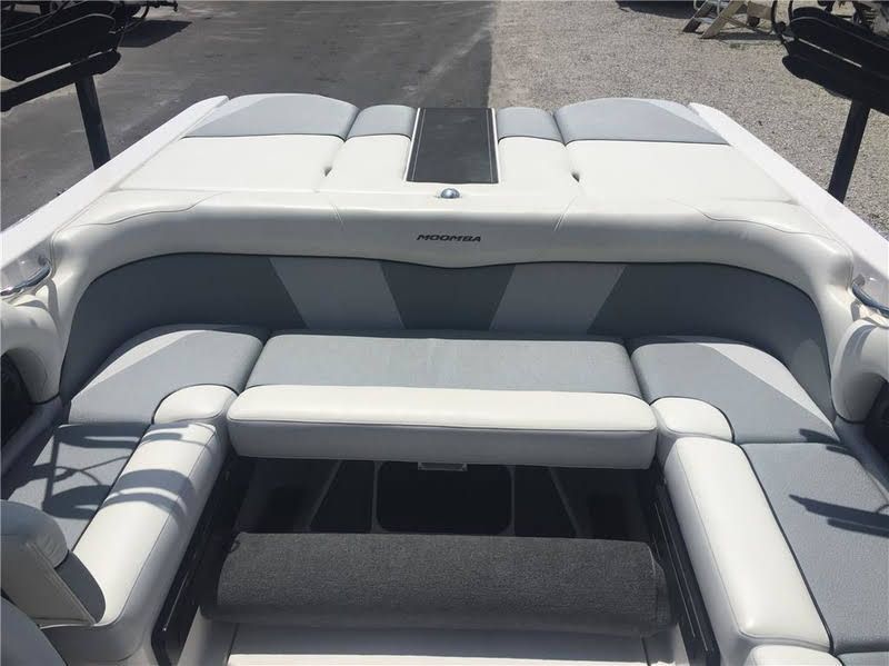 The image shows the rear seating area of a 2016 Moomba Mondo boat with gray and white upholstery.