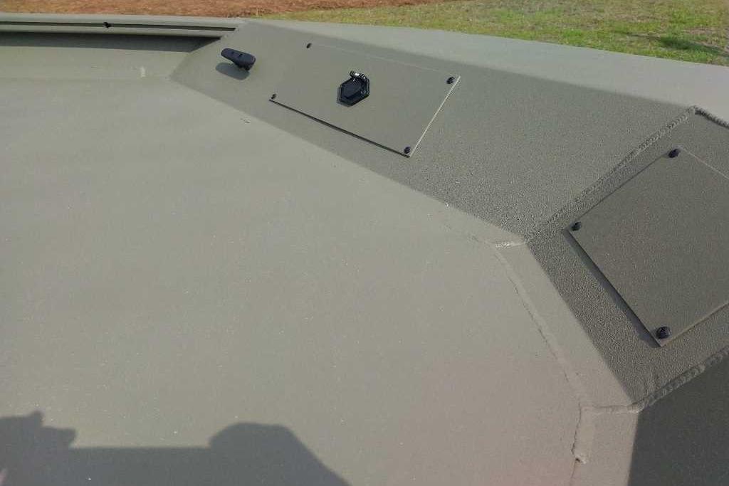 2026 Tracker Grizzly 1860 CC boat deck, featuring a textured surface and mounted fixtures.