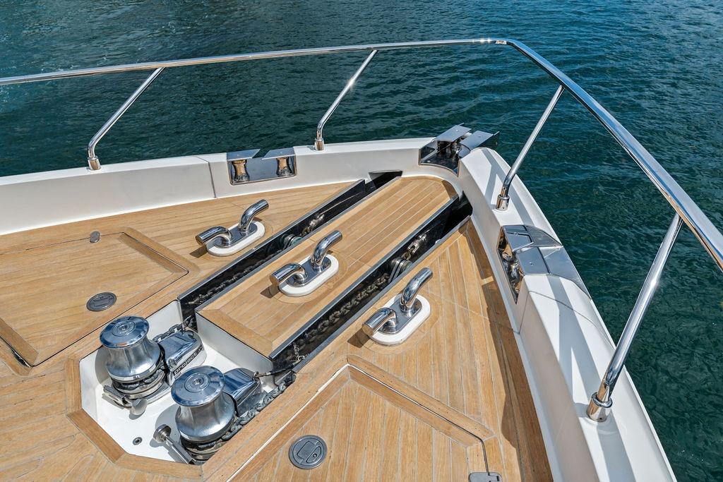 Bow deck of 2018 Ferretti Yachts 850 Motoryacht with teak flooring and stainless steel fittings.