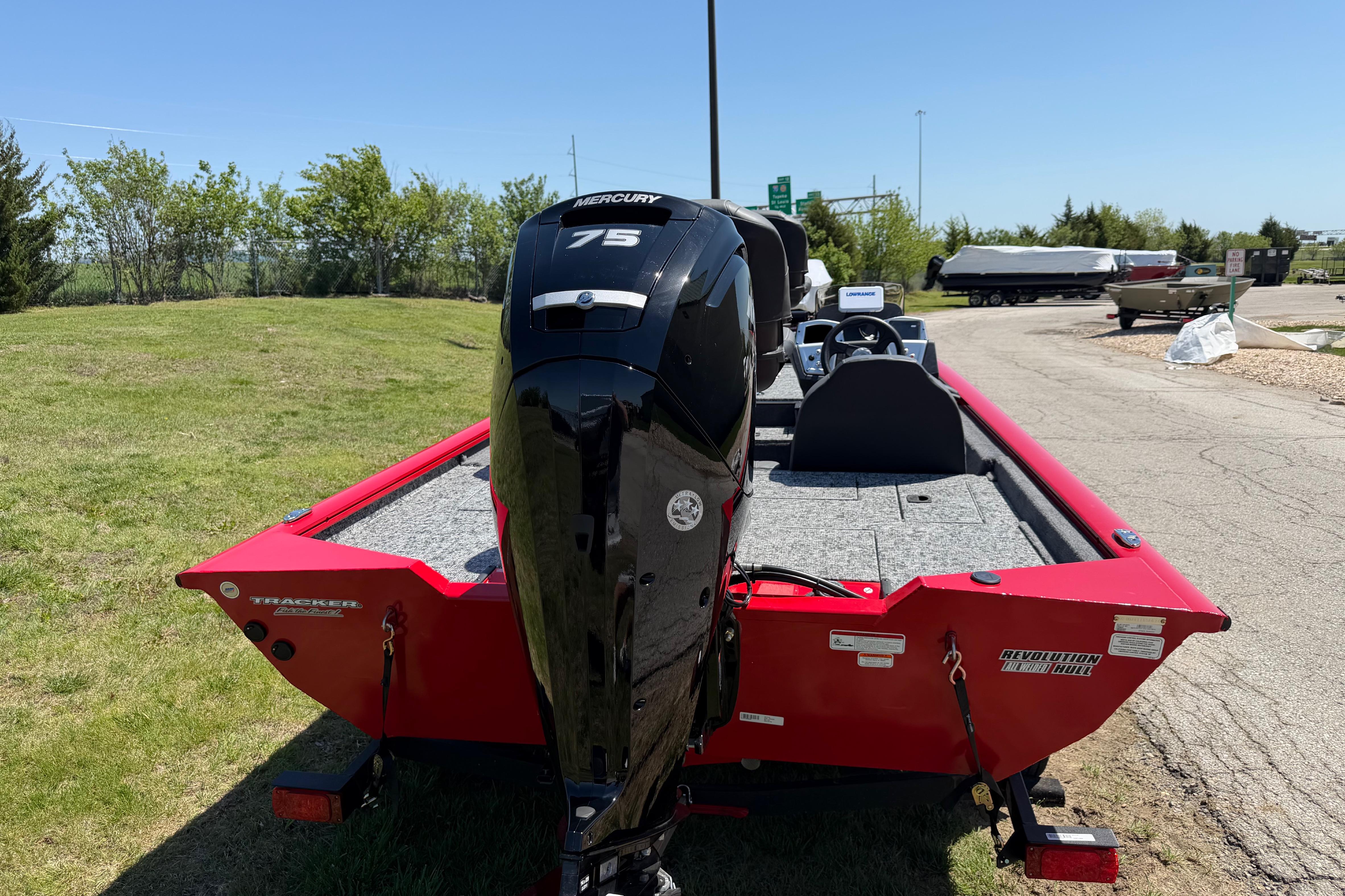 2026 Tracker Pro Team 175 boat with Mercury 75 engine, parked outdoors.