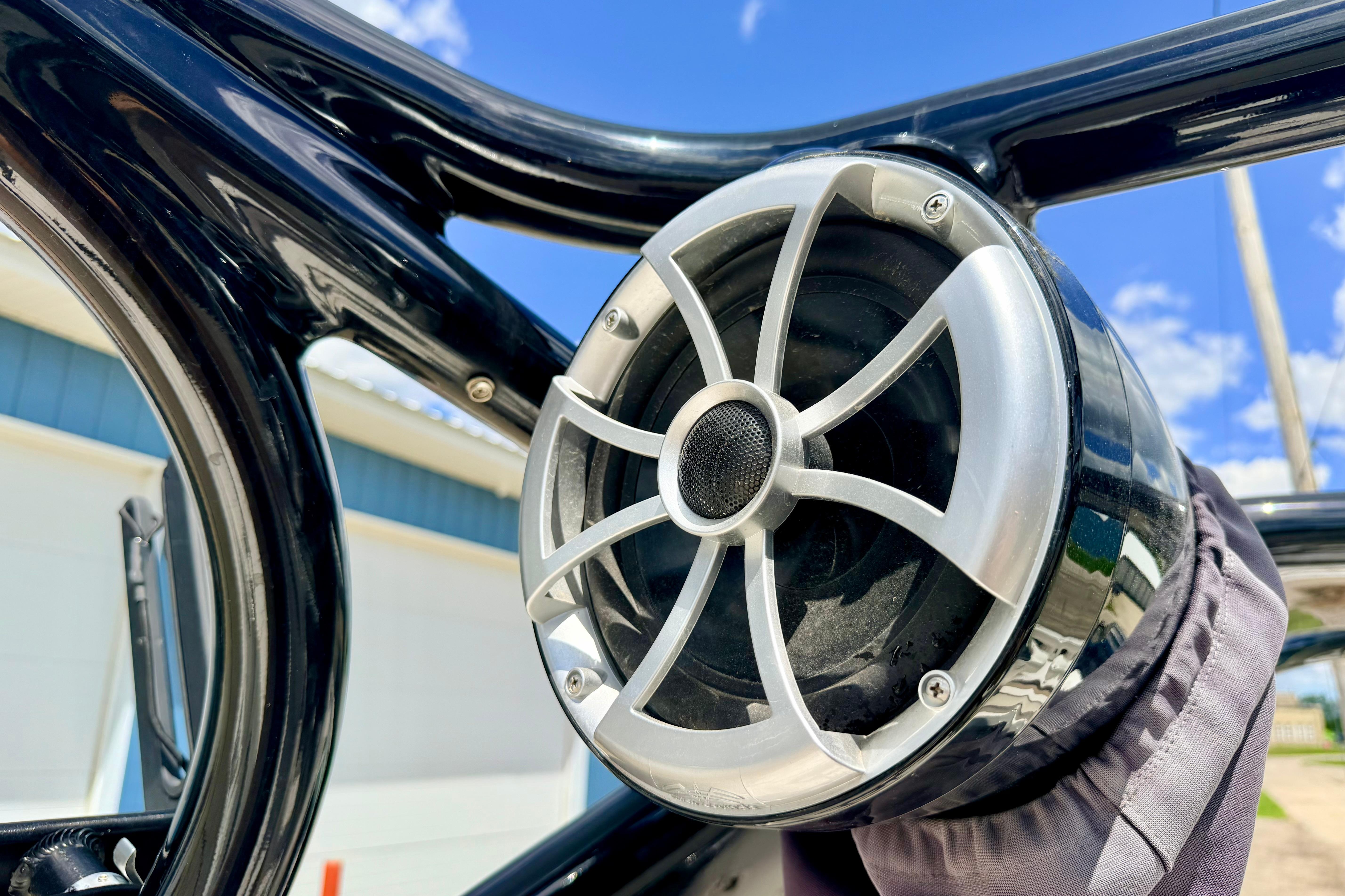 Close-up of a speaker on a 2015 Chaparral Sunesta 264 boat under a clear blue sky.
