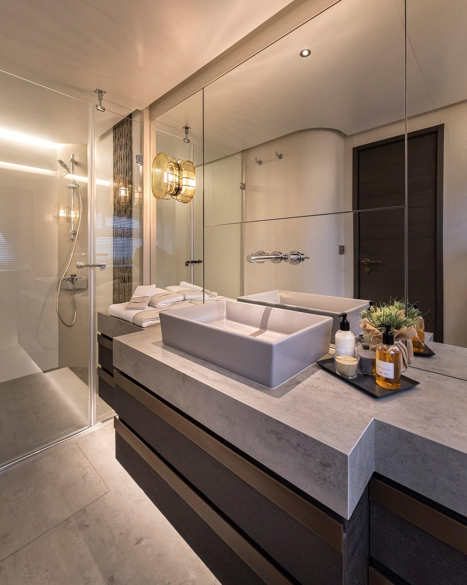 Luxurious bathroom in 2025 Numarine 26XP yacht, featuring modern fixtures and elegant design.