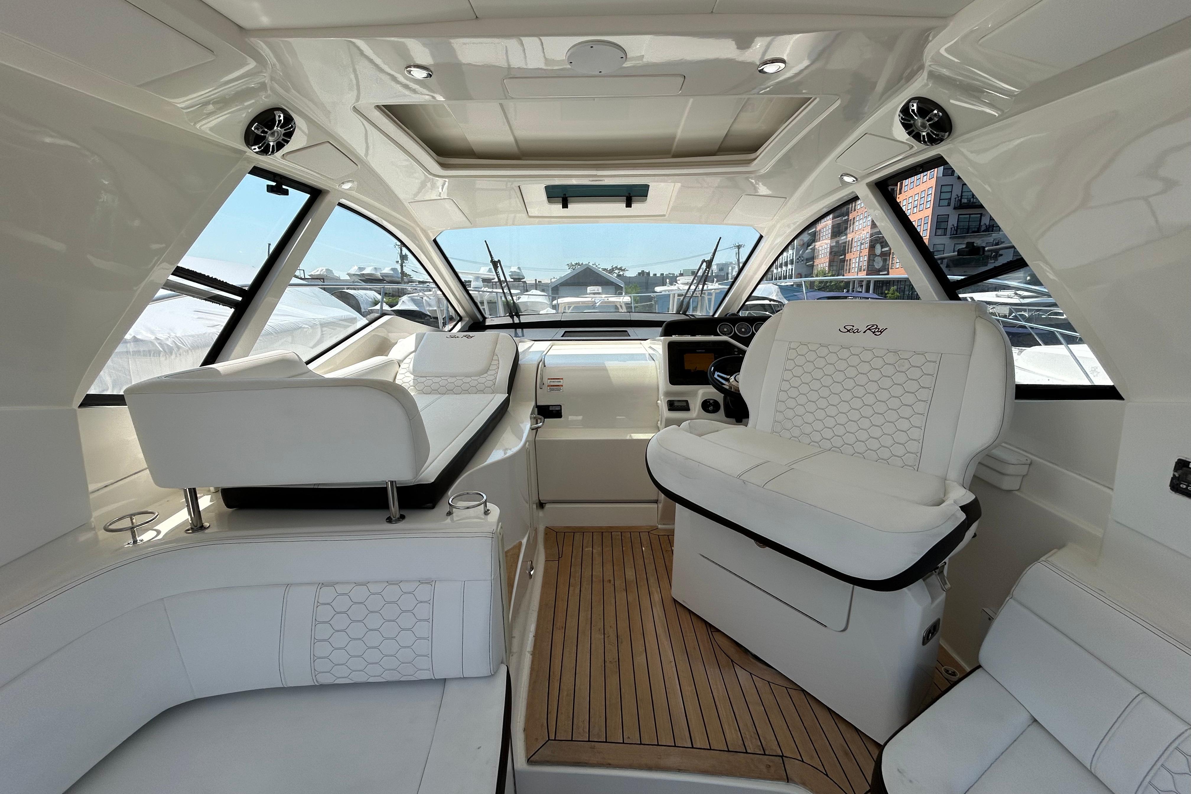 Interior of 2019 Sea Ray Sundancer 350 yacht with luxurious white seating.