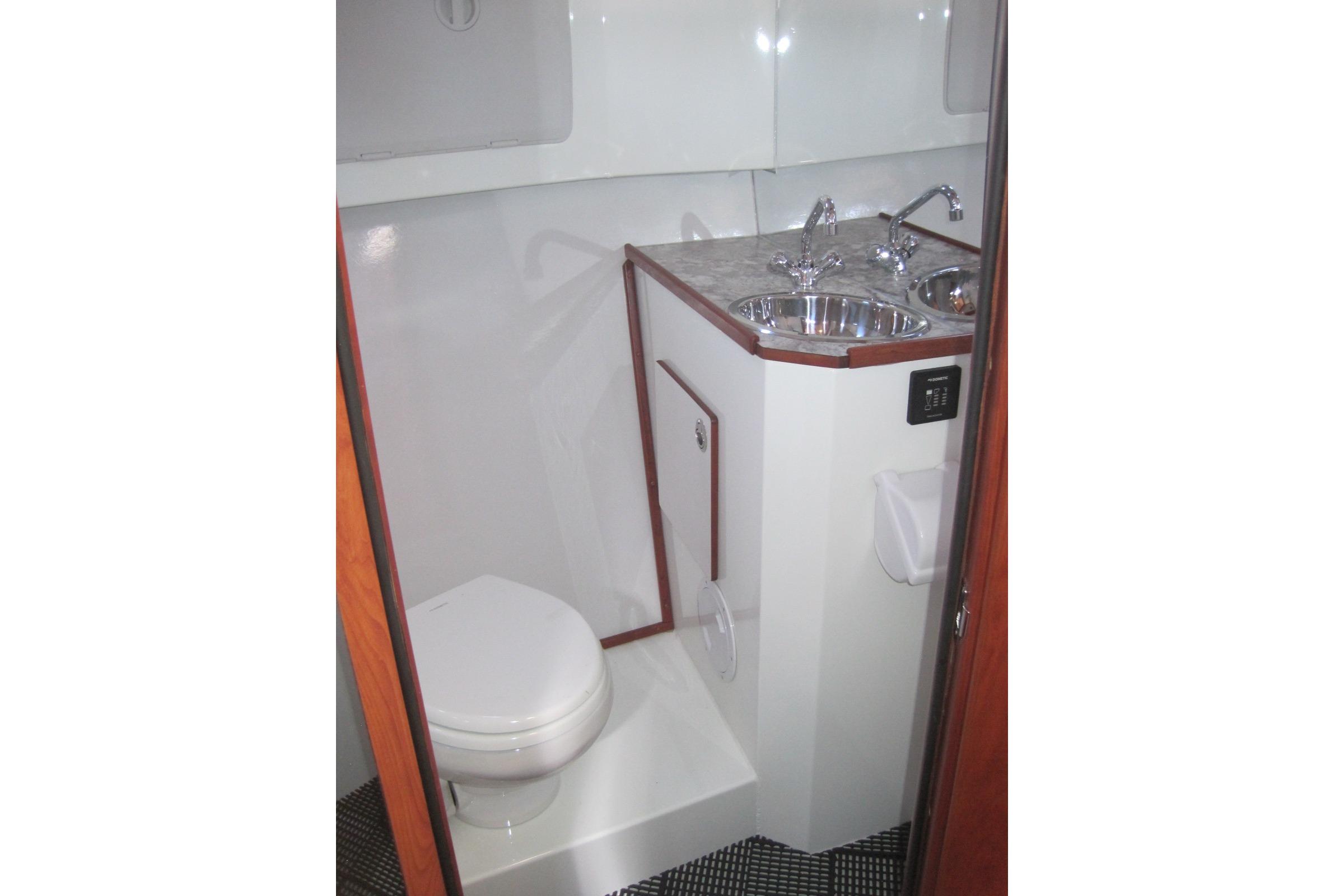 2020 EagleCraft 36' Cruiser bathroom with toilet and sink.