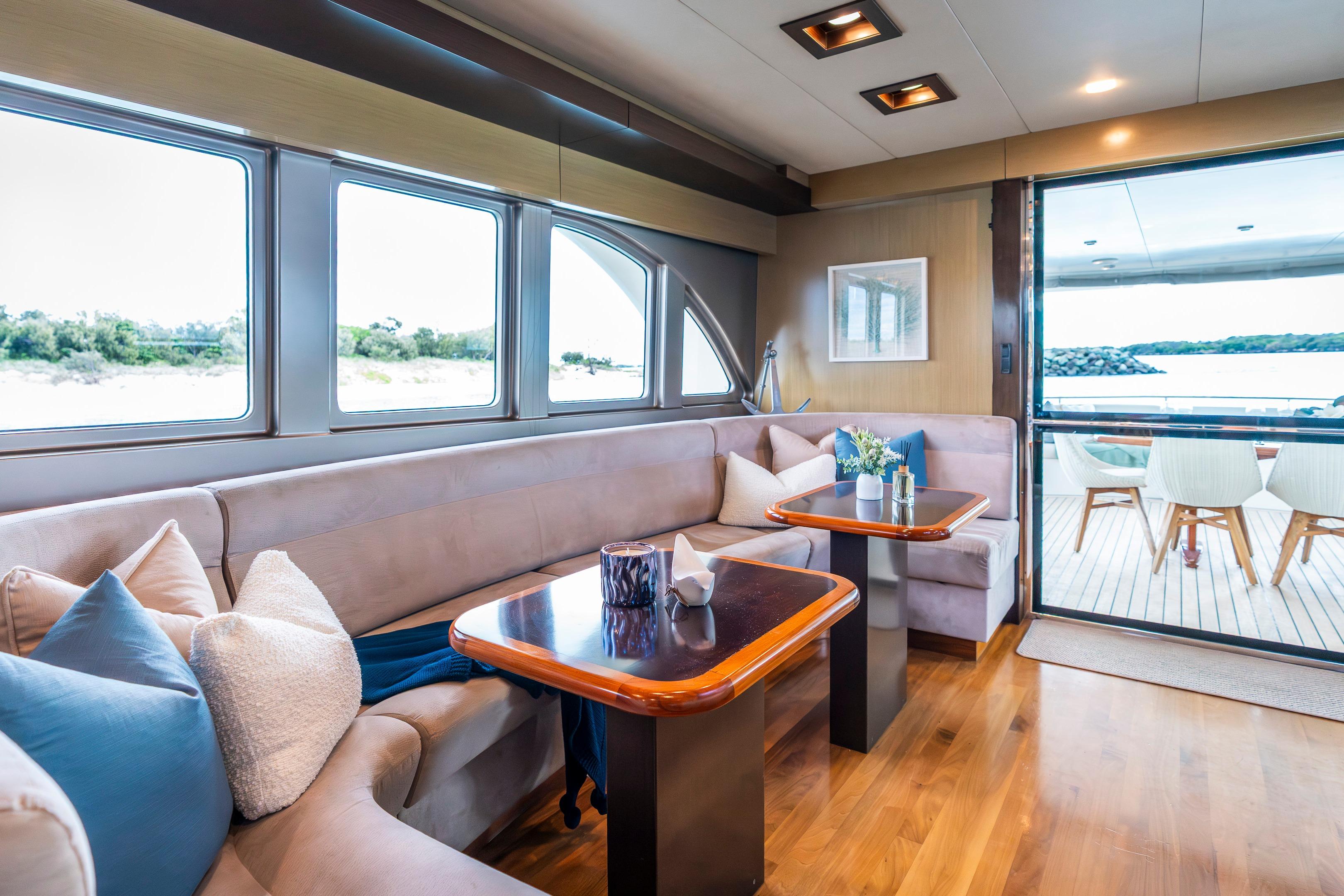 Luxurious interior of 2009 Custom Sulis Marine Expedition Yacht with elegant seating and scenic views.