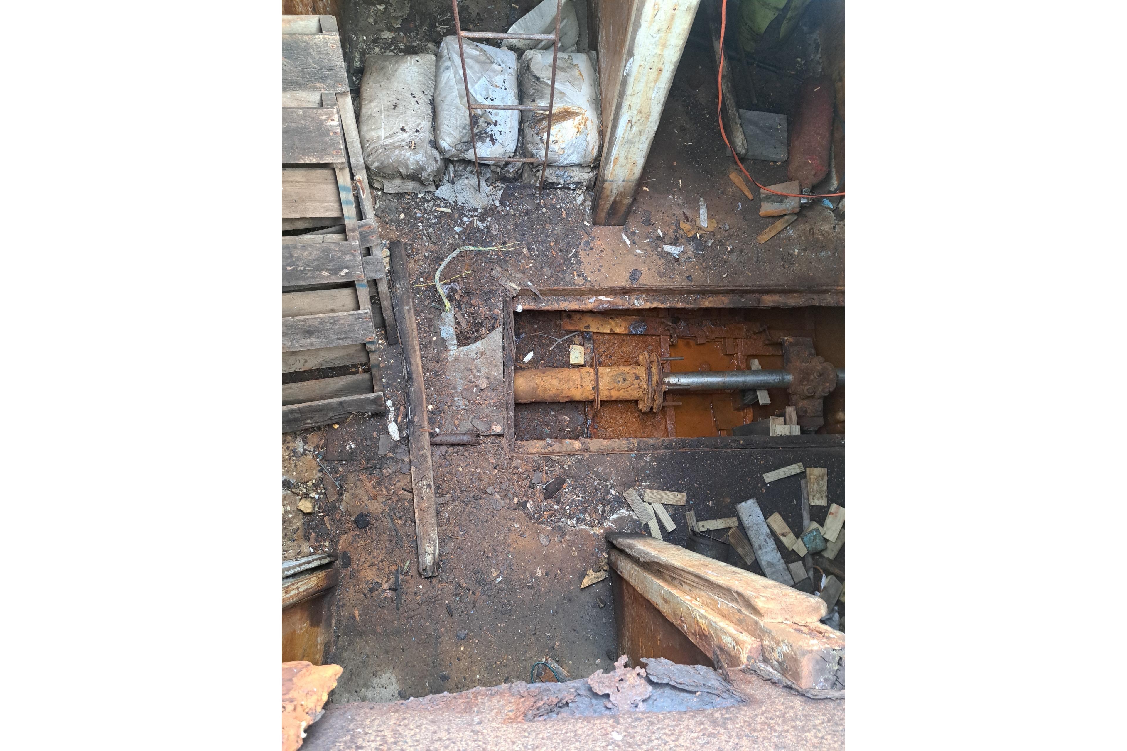 Interior view of a 1979 Custom Steel Trawler Dragger, showing exposed machinery and worn components.