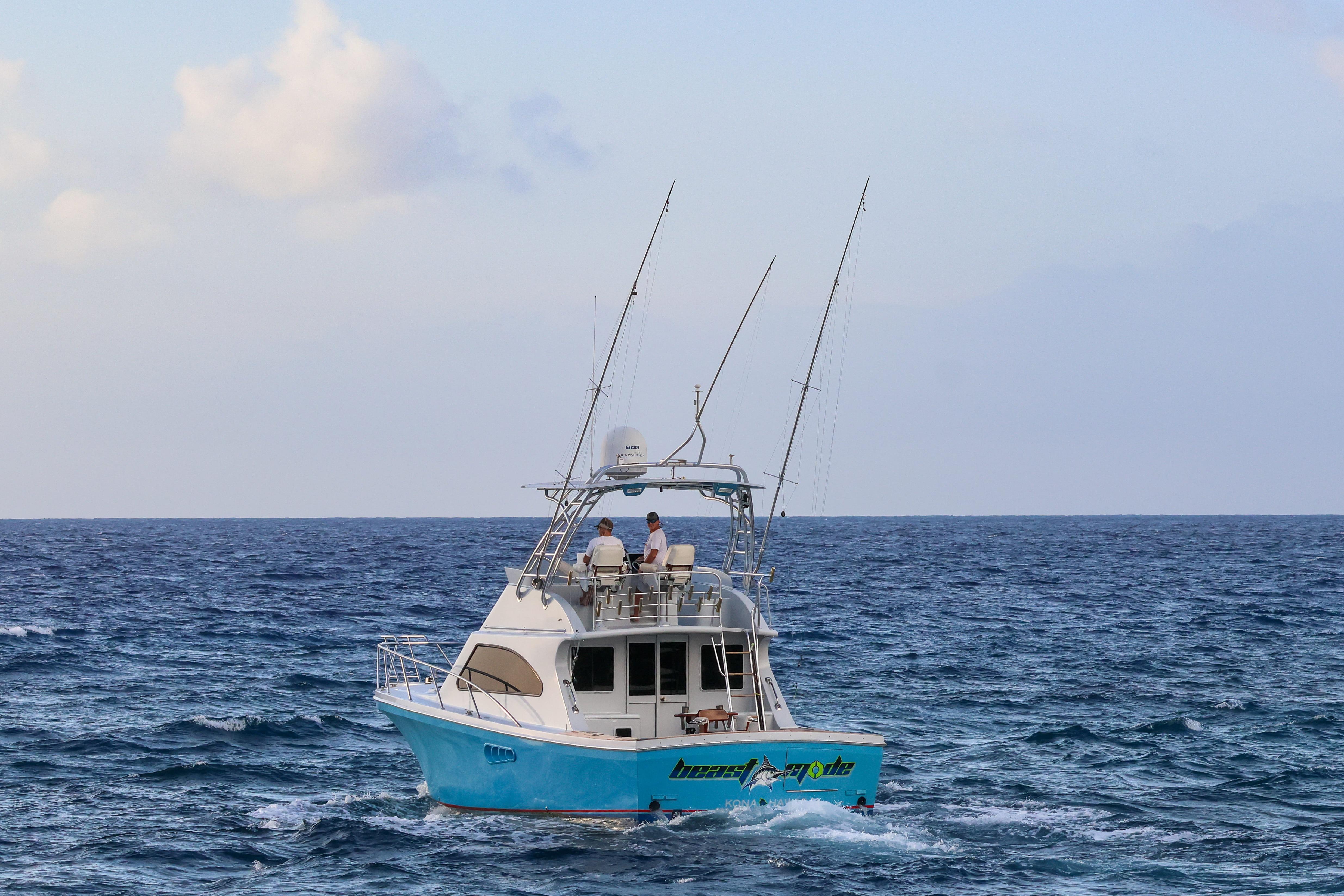 A 2001 Black Watch 40 boat navigating the ocean under a clear sky.