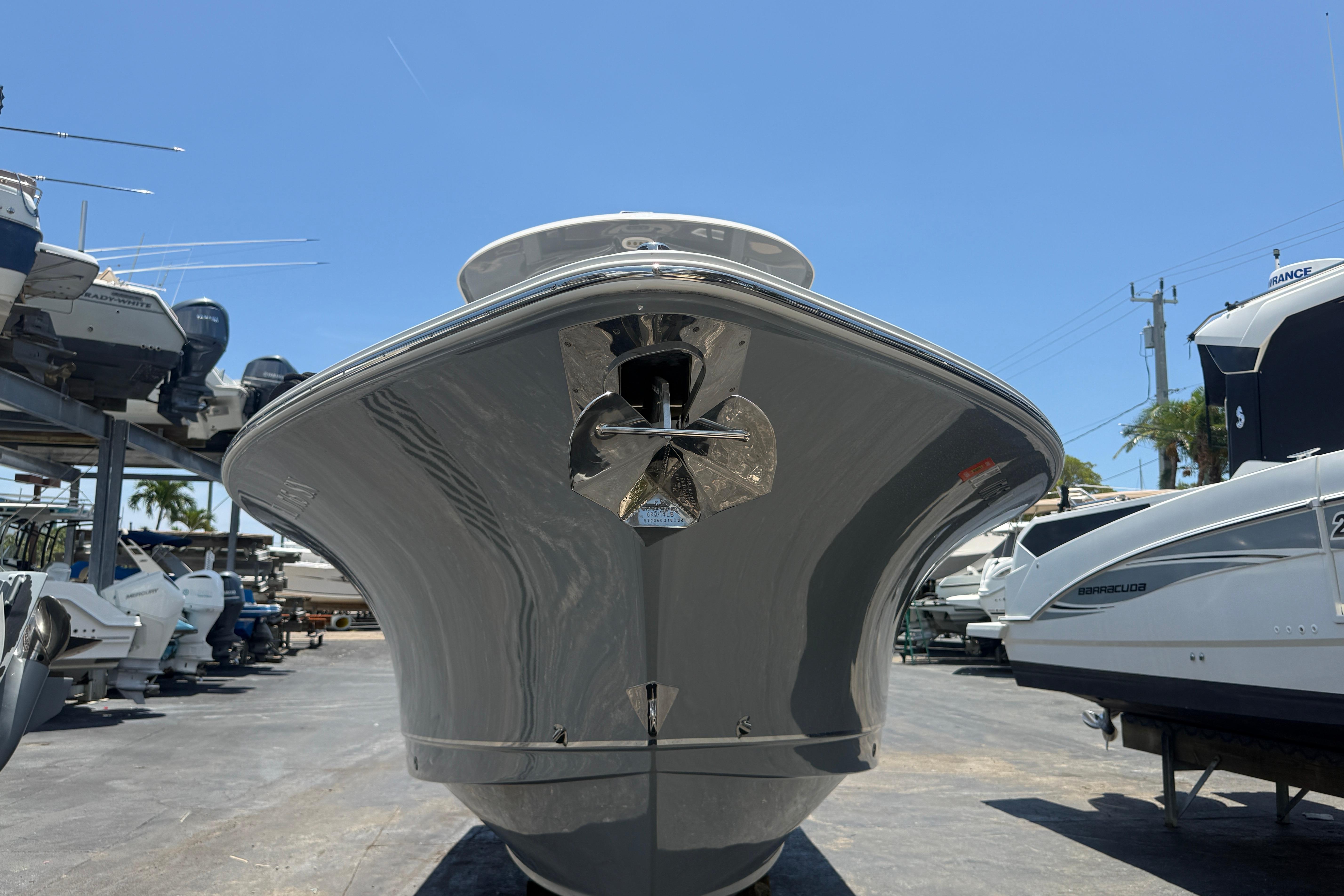 2020 Sea Hunt Ultra 275 SE boat in a marina, viewed from the front.
