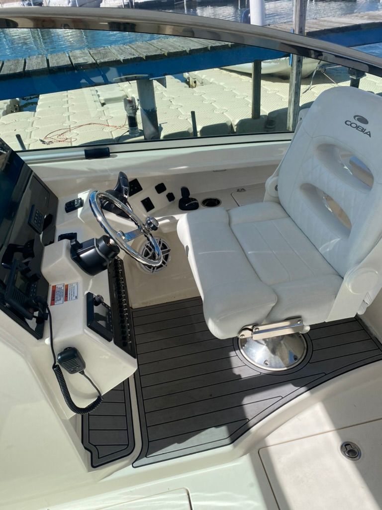 Interior view of a 2023 Cobia 330 boat cockpit.