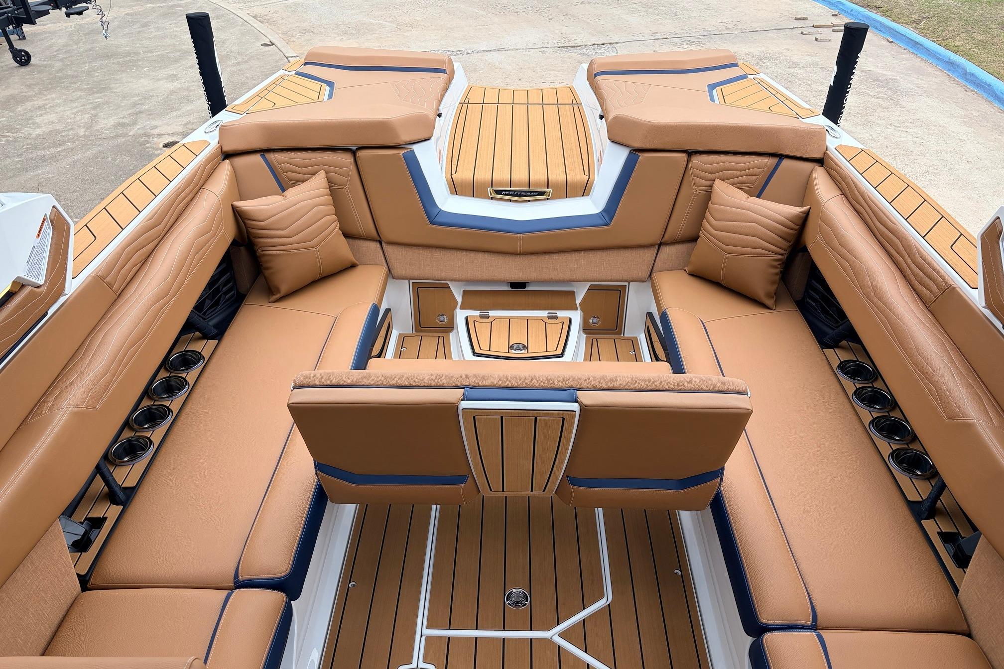 Luxurious interior of 2026 Nautique Super Air Nautique G25 boat with tan seating.