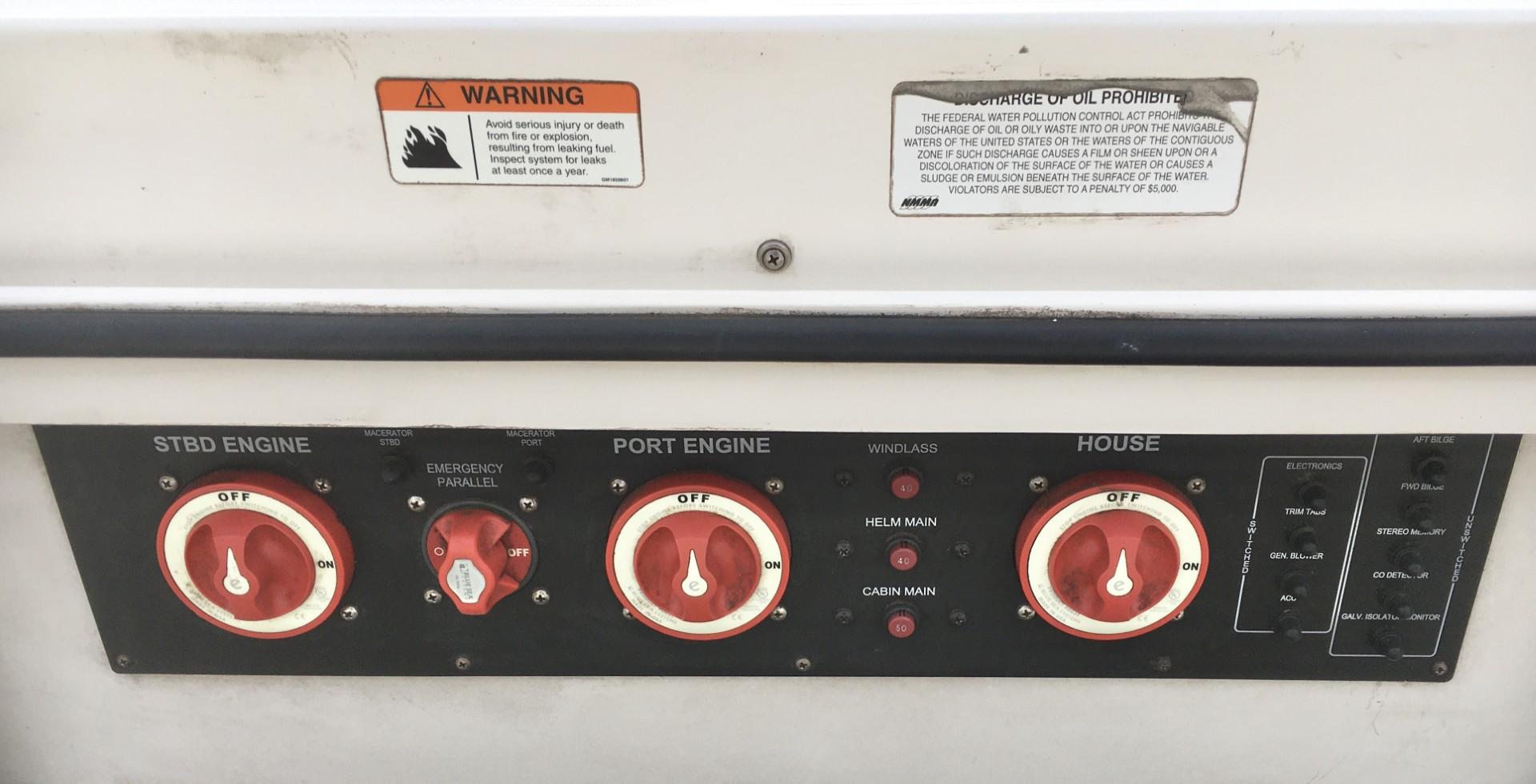Control panel of a 2006 Seaswirl Striper 2901 Walkaround O/B boat with warning labels.