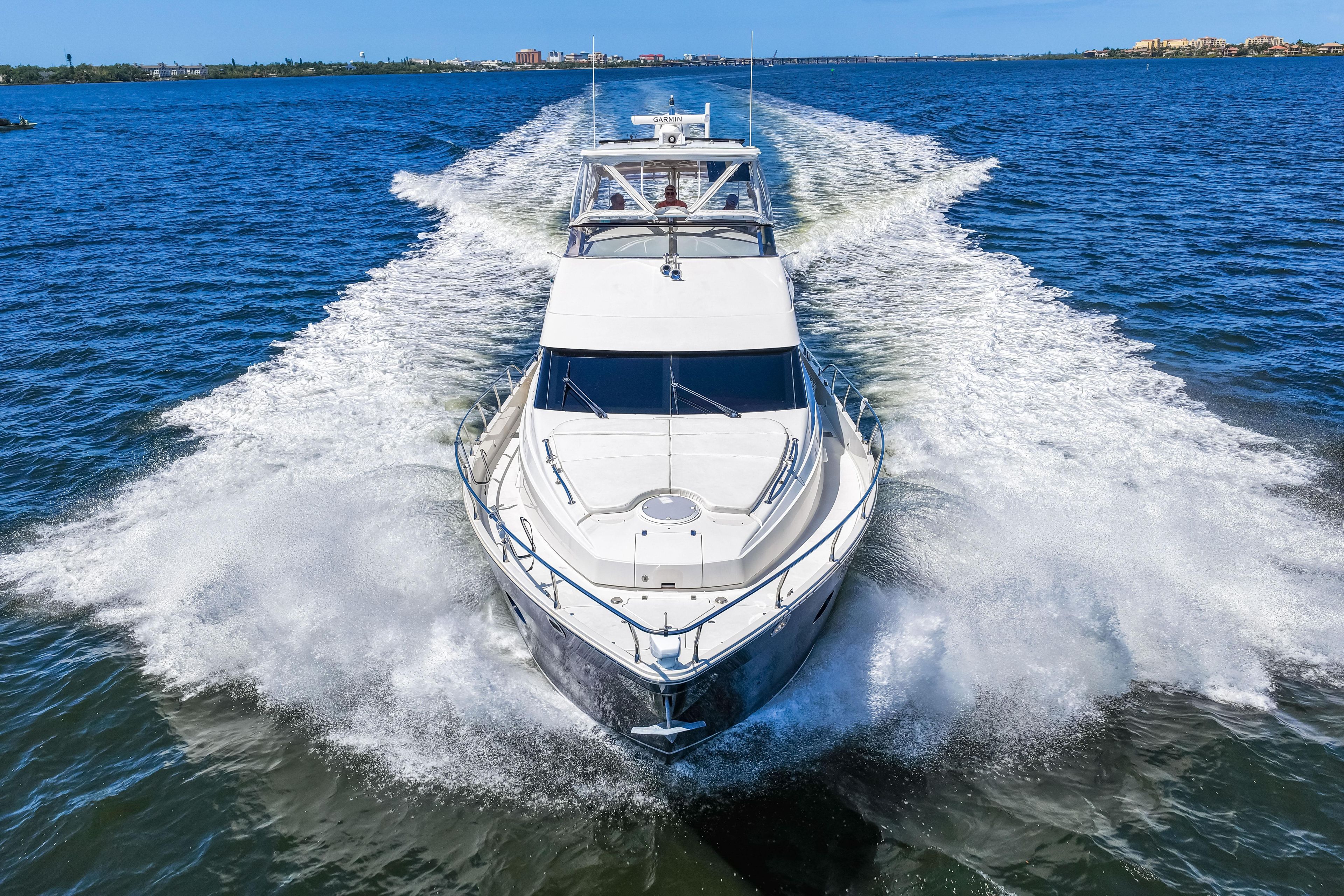 2007 Marquis 59 Markham Edition yacht cruising on open water, creating a dynamic wake.