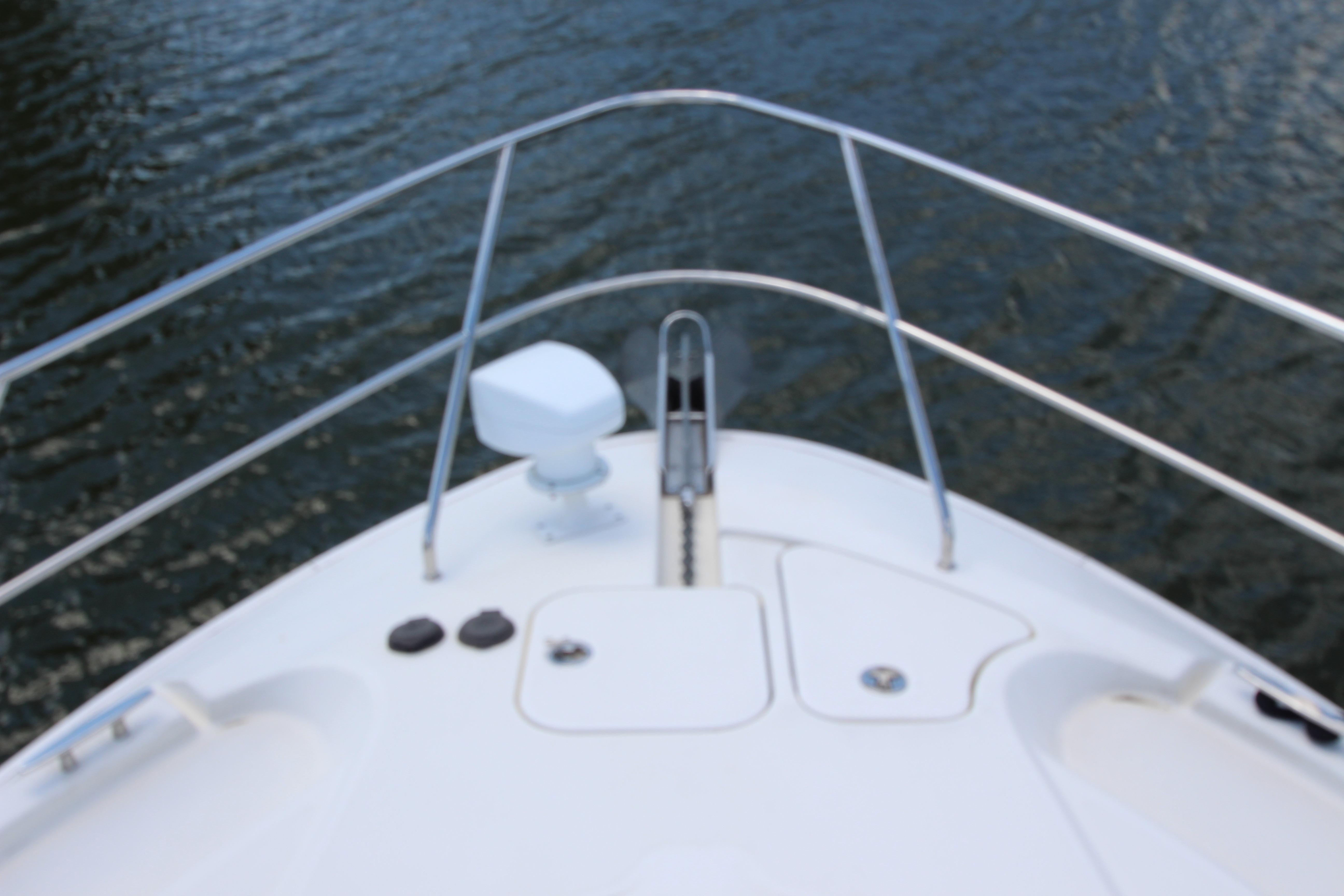 Bow view of 2006 Silverton 38 Sport Bridge on water.