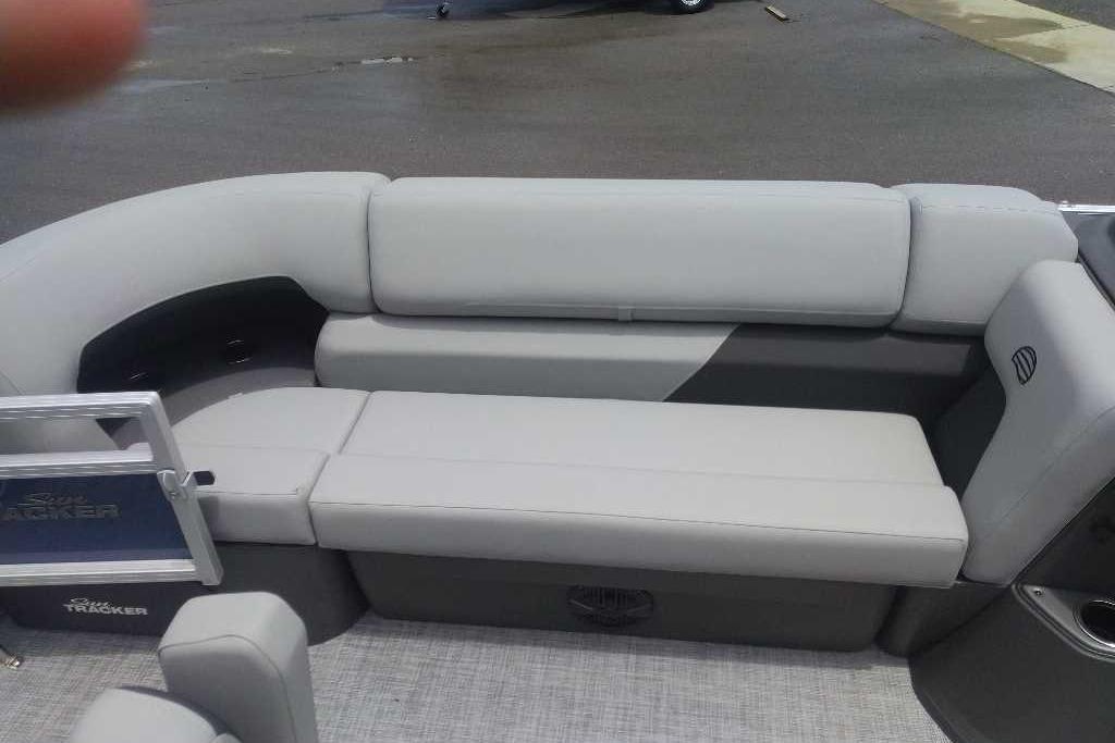 2026 Sun Tracker SportFish 20 DLX boat interior with gray cushioned seating.